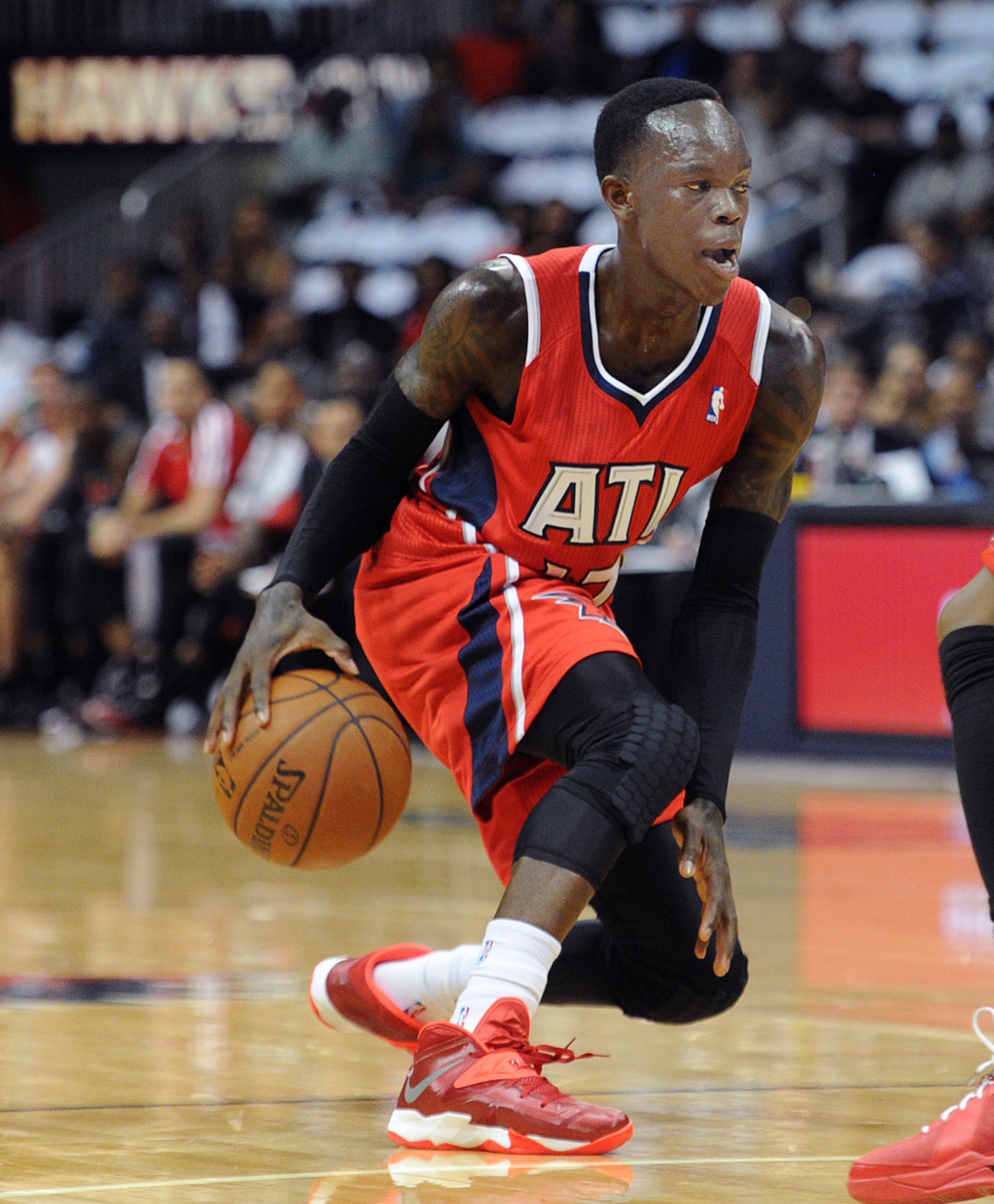 The Hawks' Dennis Schroder dribbles behind his back against the Toronto Raptors on November 1, 2013. JOHNNY CRAWFORD / JCRAWFORD@AJC.COM