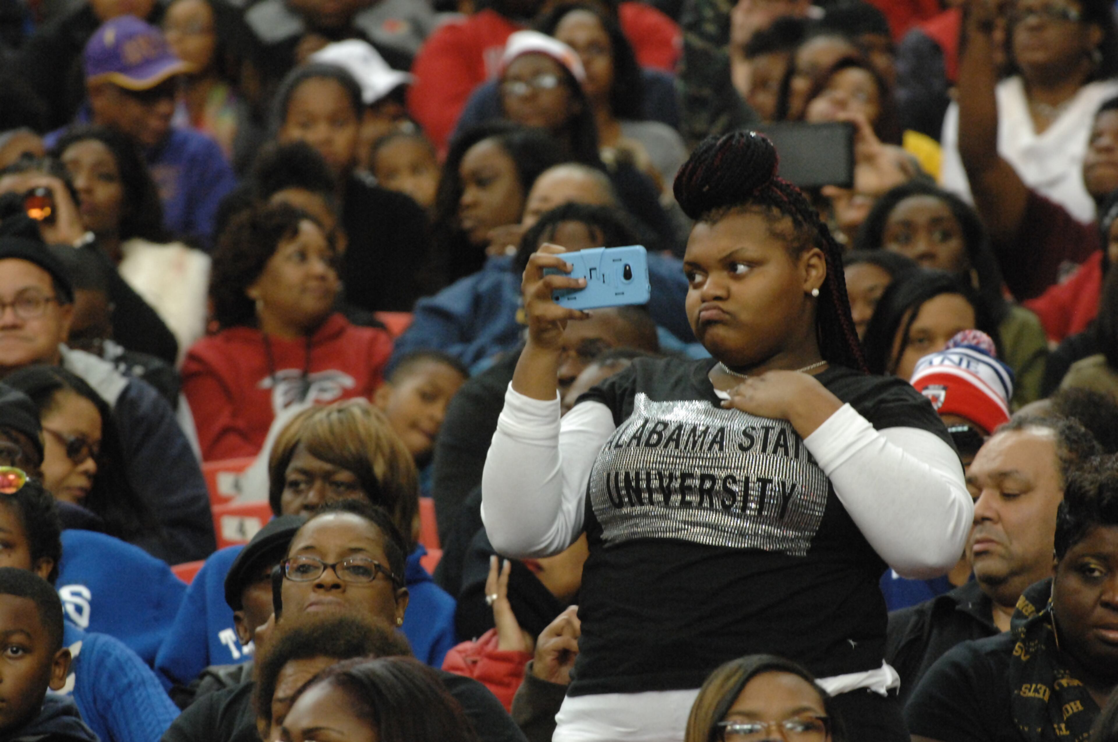 012817 A fan of the Alabama State Marching Band uses her cellphone. Battle of the Bands at the Georgia Dome in Atlanta.
W.A. Bridges Jr. special
