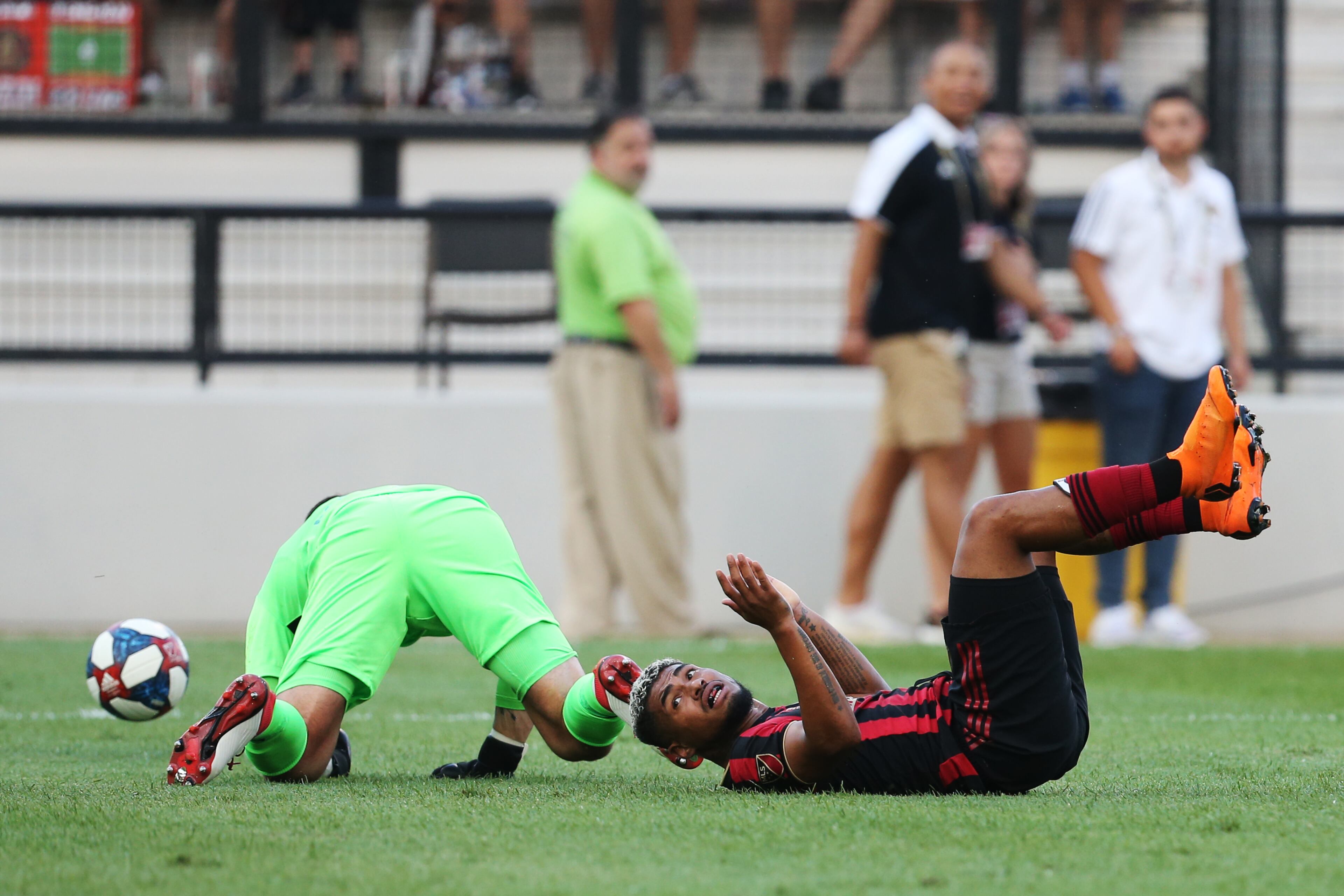 Josef Martinez (right) of Atlanta United collides with the Saint Louis FC goalkeeper, Tomas Gomez. Christina Matacotta/Christina.Matacotta@ajc.com