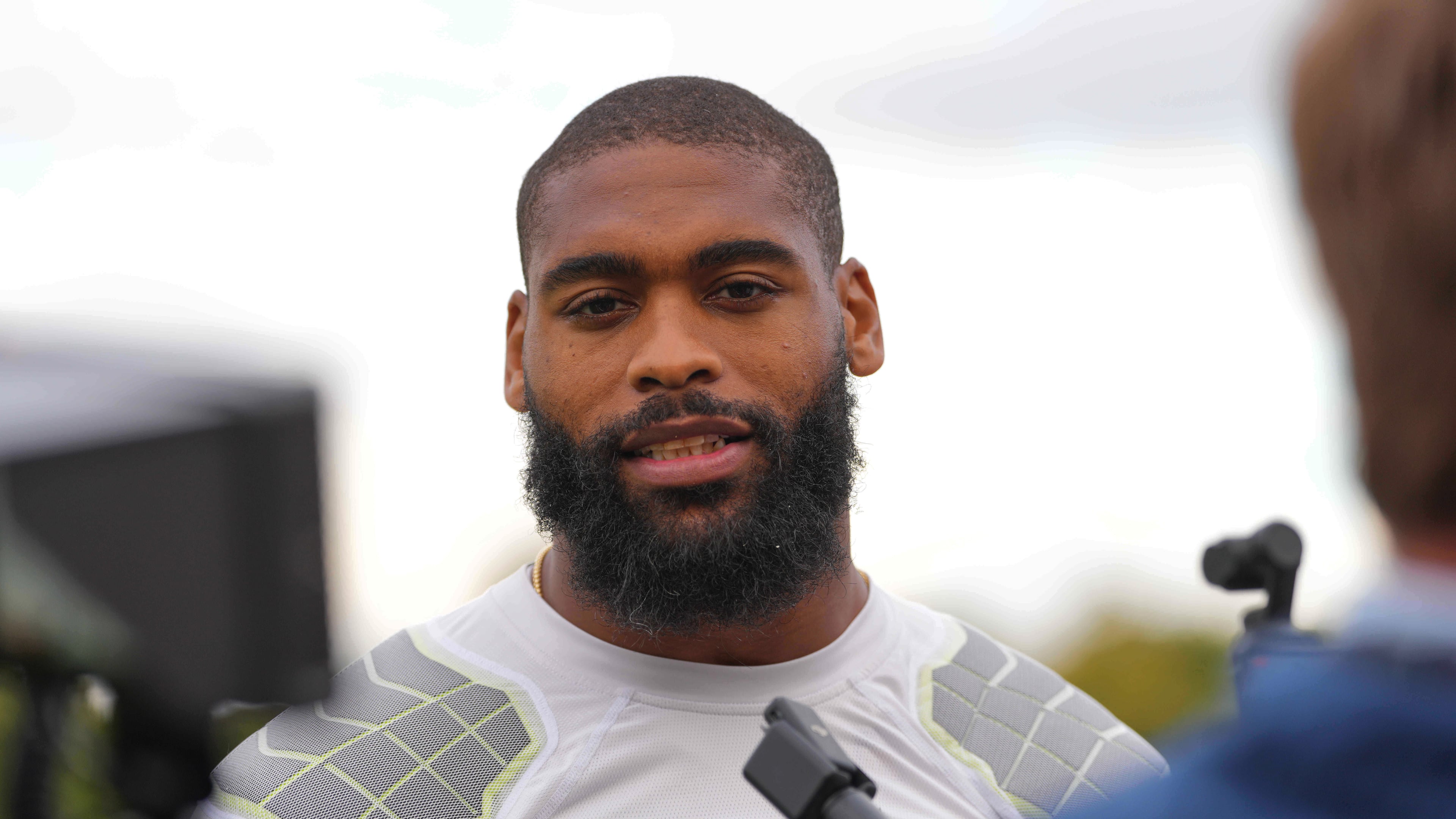 FILE - Denver Broncos' Jonathon Cooper speaks to the media at NFL football practice at Tottenham Hotspur training ground in London, Wednesday, Oct. 8, 2025. (AP Photo/Kirsty Wigglesworth, File)