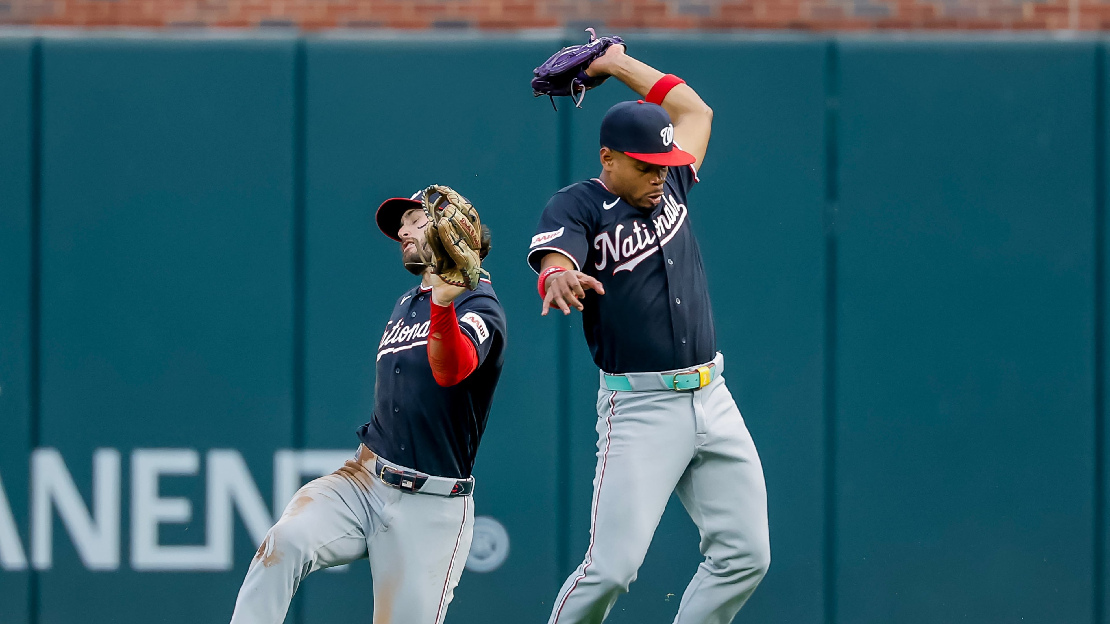 Washington Nationals second baseman José Tena, right, catches fly ball hit by Atlanta Braves catcher Joey Bart, as Nationals right fielder Dylan Crews avoids a collision during the second inning of a baseball game, Friday, July 31, 2026, in Atlanta. (AP Photo/Erik S. Lesser)