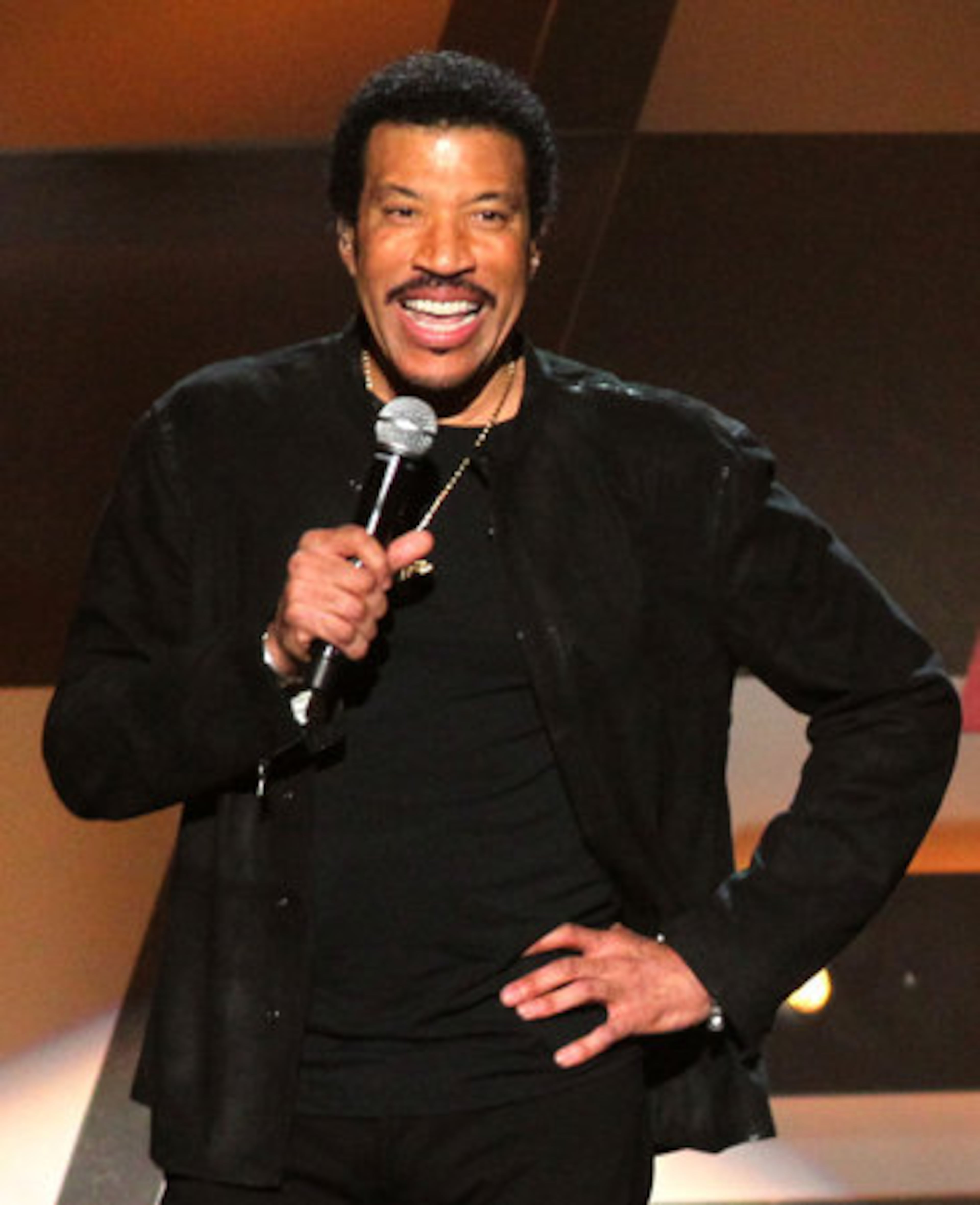 Lionel Richie speaks onstage.
