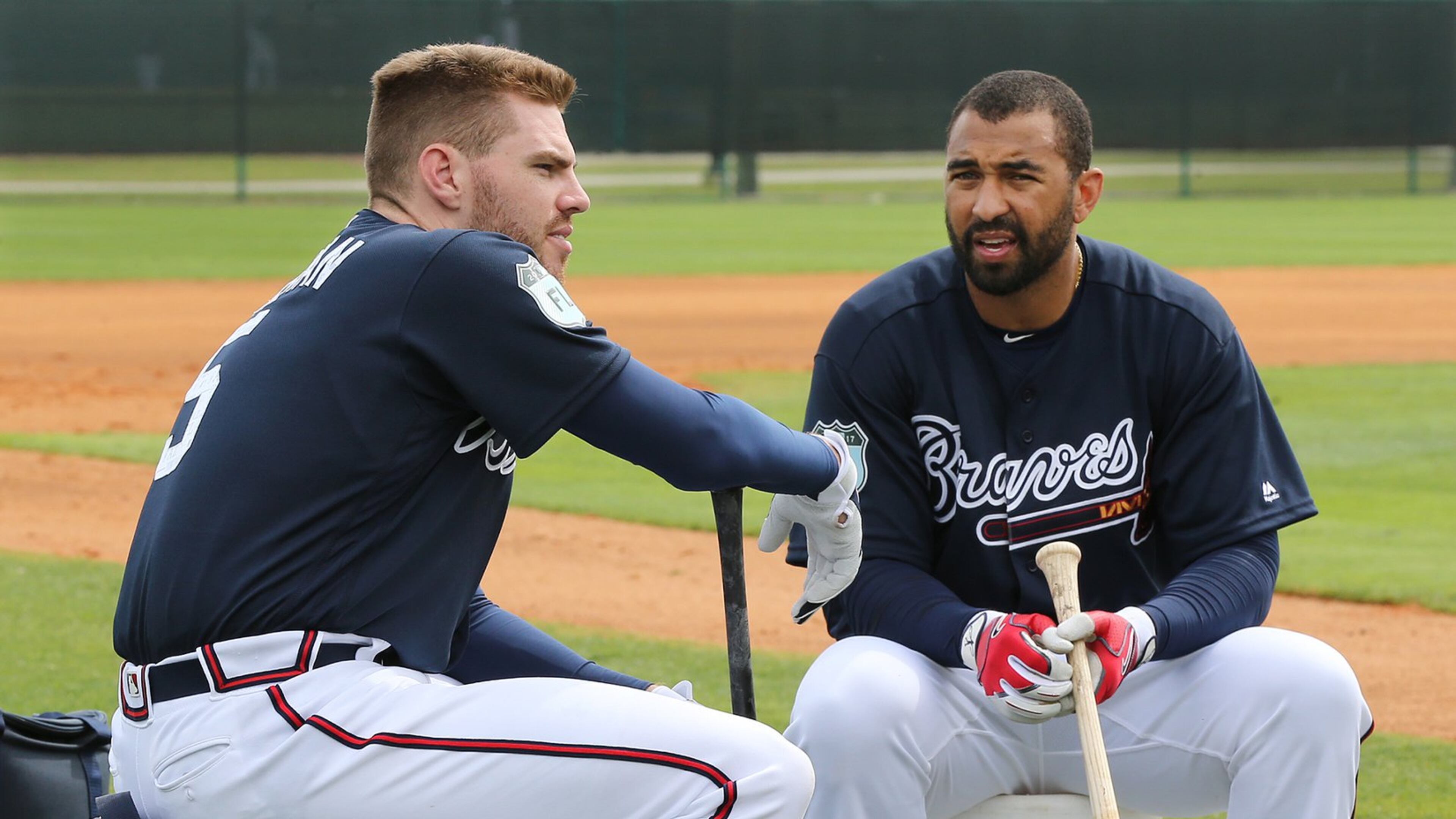 Freddie Freeman (left) chats with Matt Kemp during a break in an early spring training workout. Freeman is 5-for-6 with four RBIs in his past two games and has a .524 average (22-for-42) that would lead the majors if he wasn’t just shy of the minimum plate appearances to qualify. (Curtis Compton/ccompton@ajc.com)