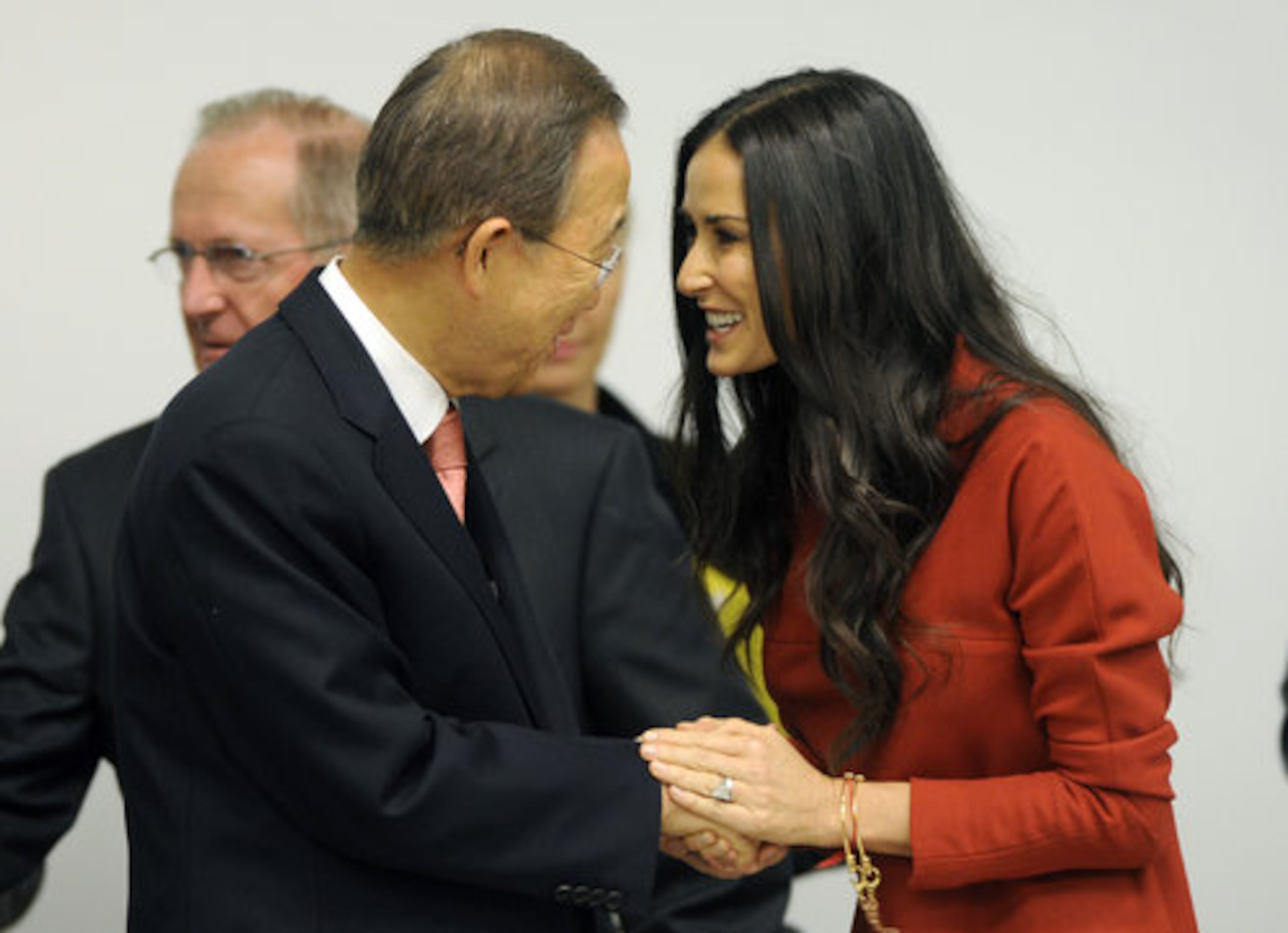 Demi Moore, right, shakes hands with United Nations Secretary-General Ban Ki-moon.