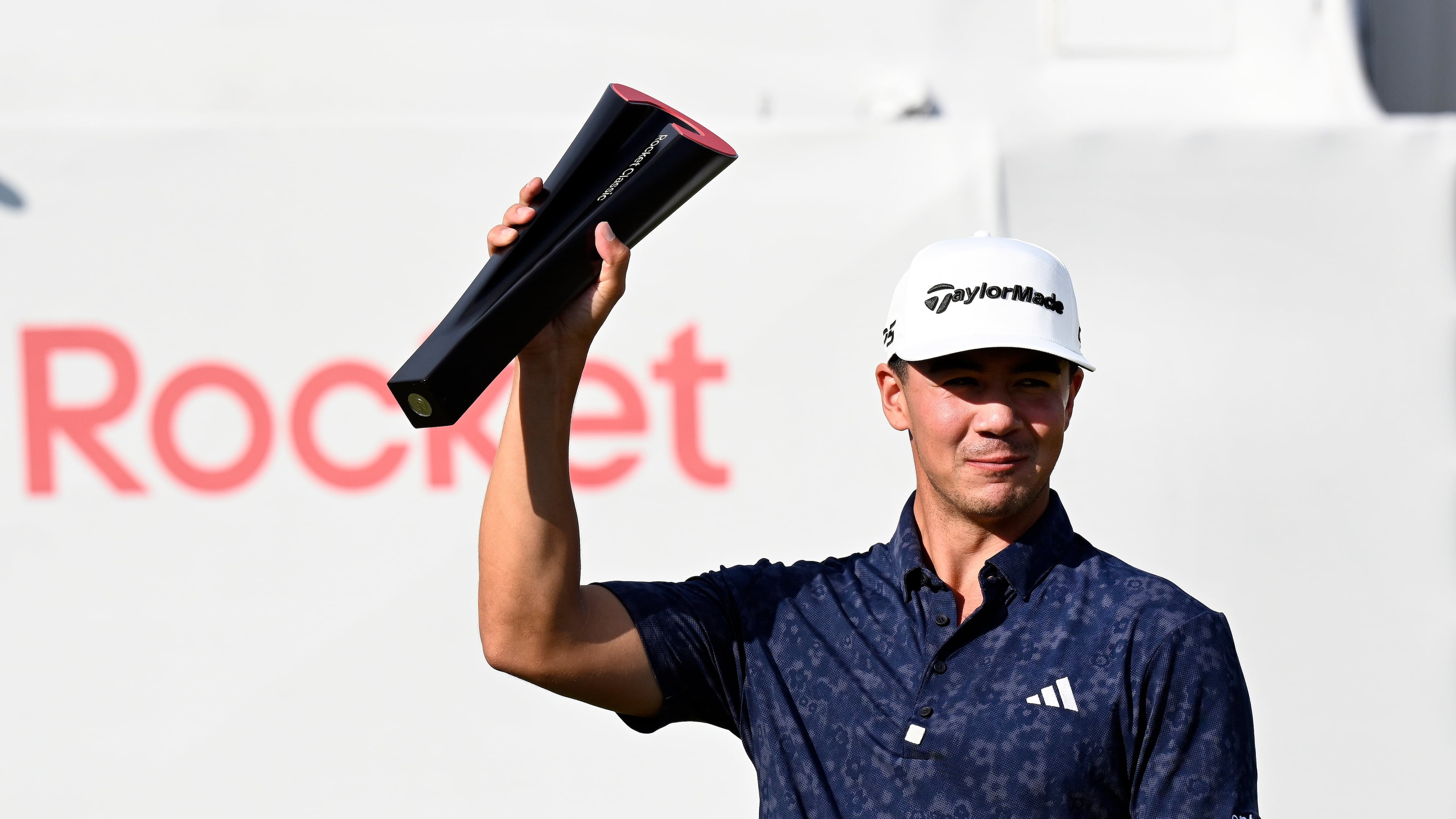 Michael Thorbjornsen hoists the trophy after winning the Rocket Classic golf tournament, Sunday, Aug. 2, 2026, in Detroit. (AP Photo/Jose Juarez)