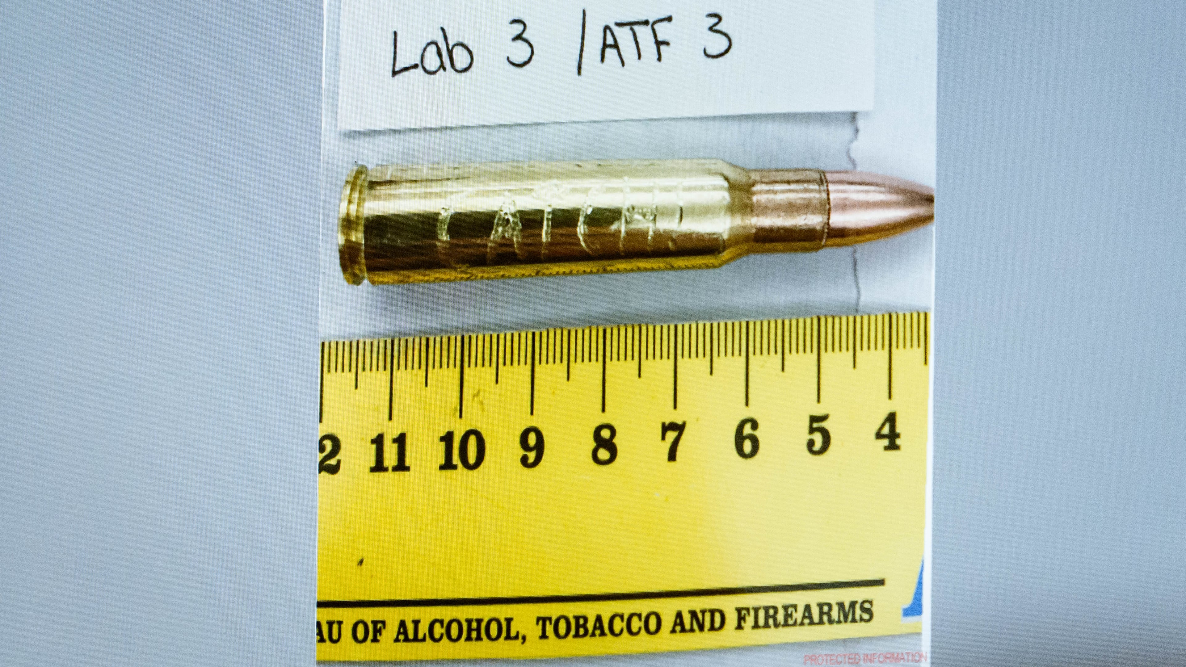 An image of a bullet casing engraved with the word "Catch!" is displayed during a preliminary hearing for Tyler Robinson, who is accused in the fatal shooting of Charlie Kirk, at the Fourth District Courthouse in Provo, Utah, Thursday, July 9, 2026. (AP Photo/Spenser Heaps, Pool)