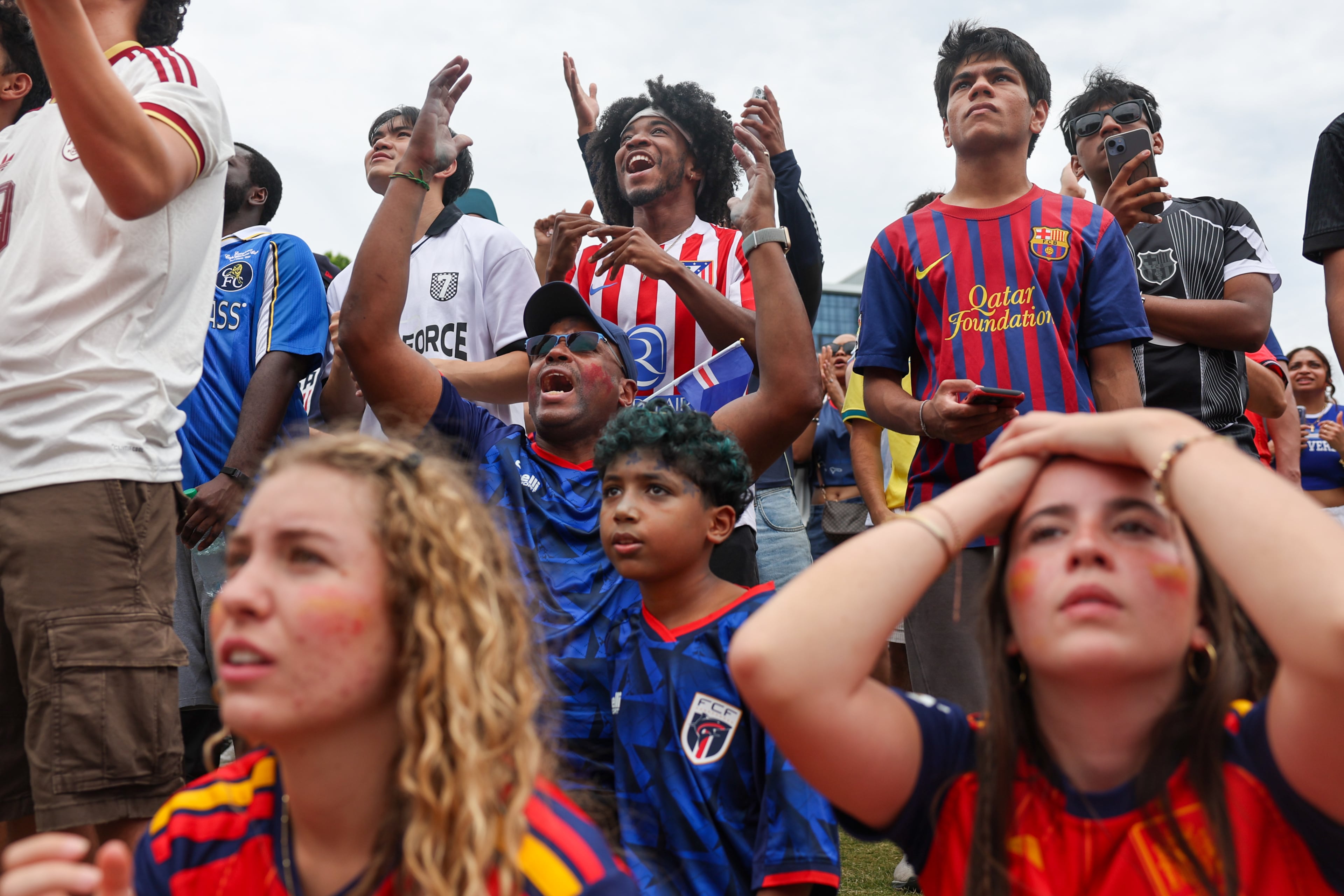 Fans react in the final minutes at FIFA Fan Festival in Centennial Olympic Park during Monday's Spain and Cape Verde match. (Arvin Temkar/AJC)
