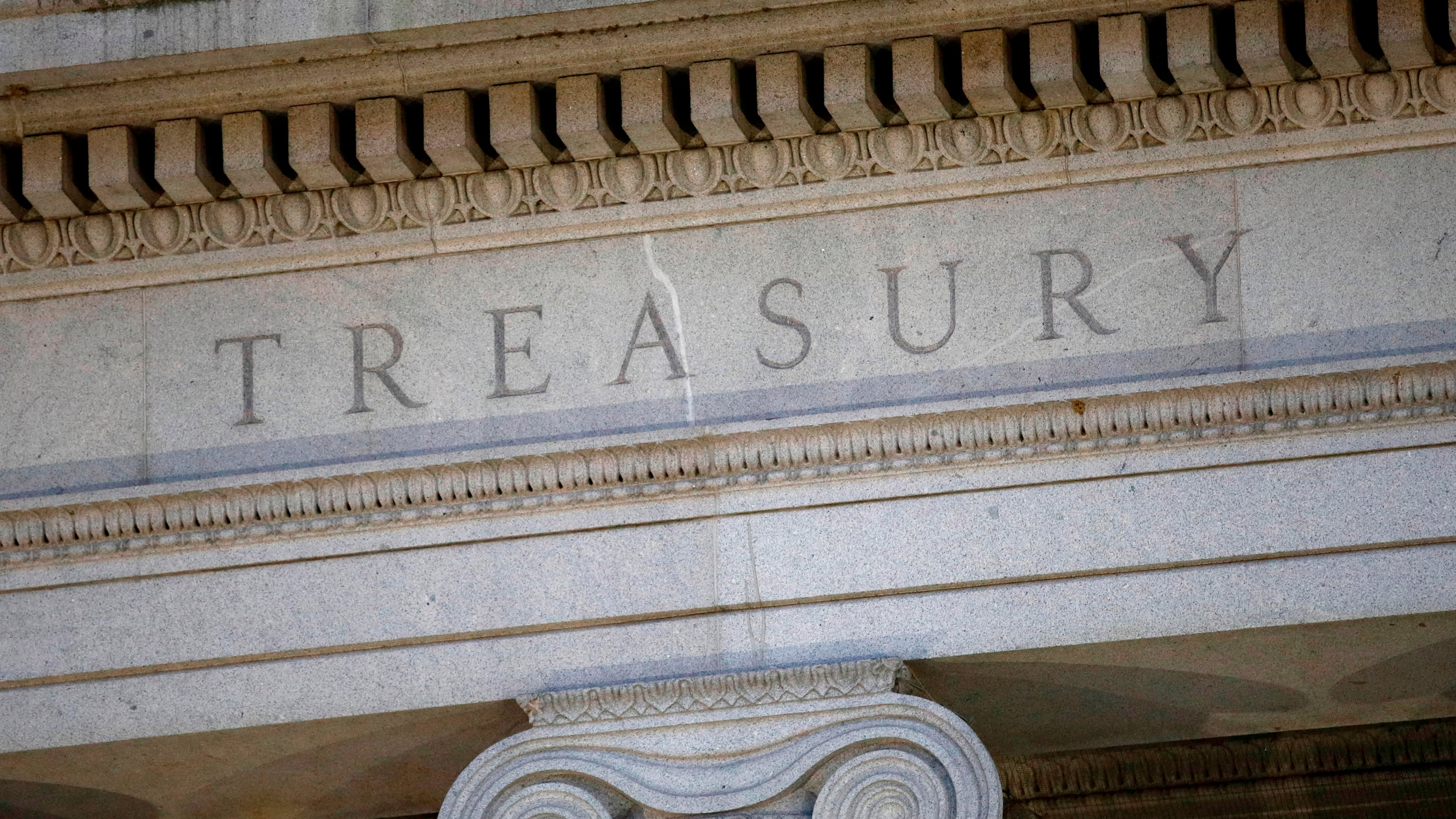 FILE - The Treasury Department building is pictured at dusk in Washington, June 6, 2019. (AP Photo/Patrick Semansky, File)