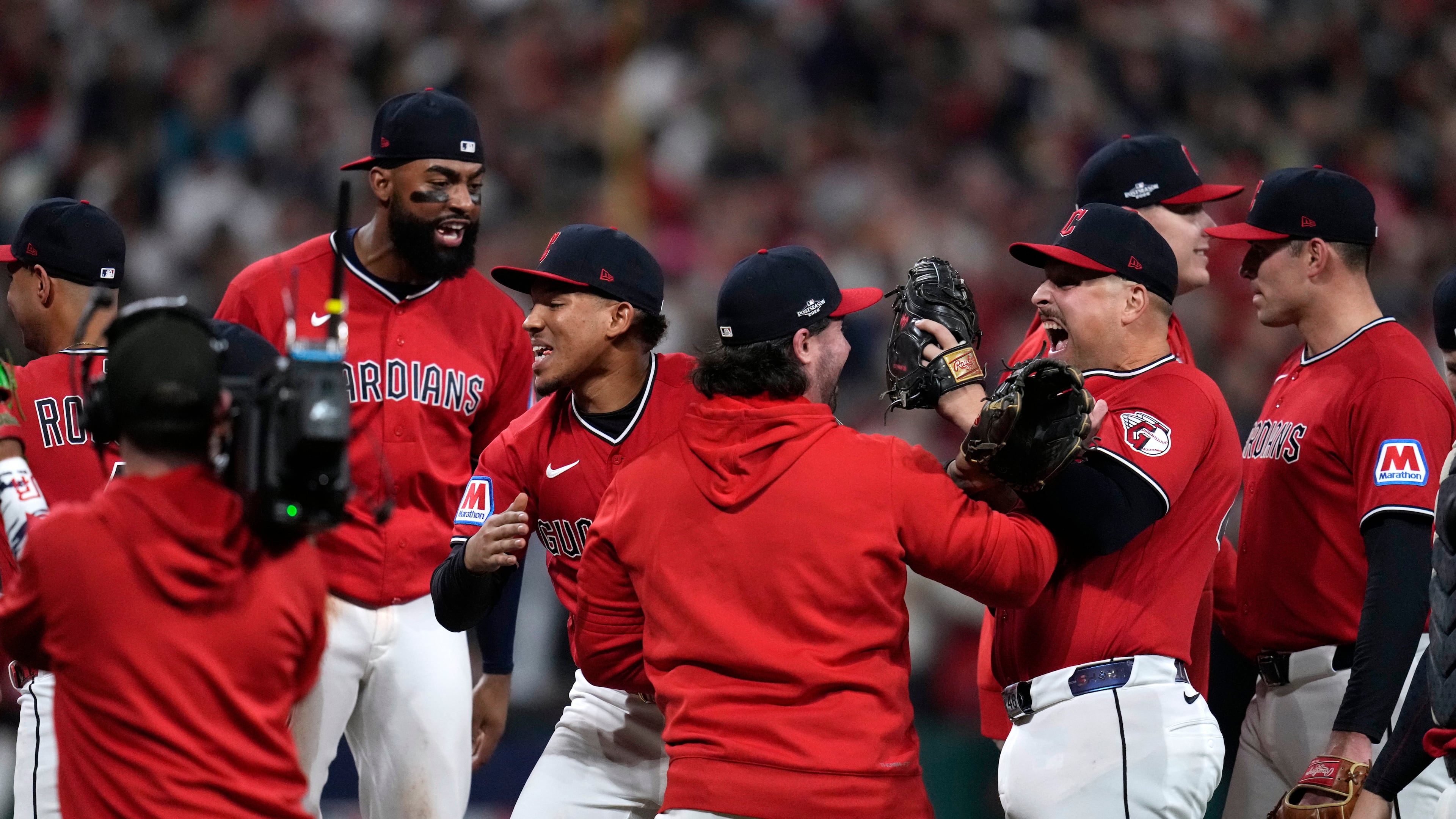 Cleveland Guardians players celebrate after Game 5 of baseball's American League Division Series against the Chicago White Sox, Saturday, Oct. 10, 2026, in Cleveland. (AP Photo/Sue Ogrocki)