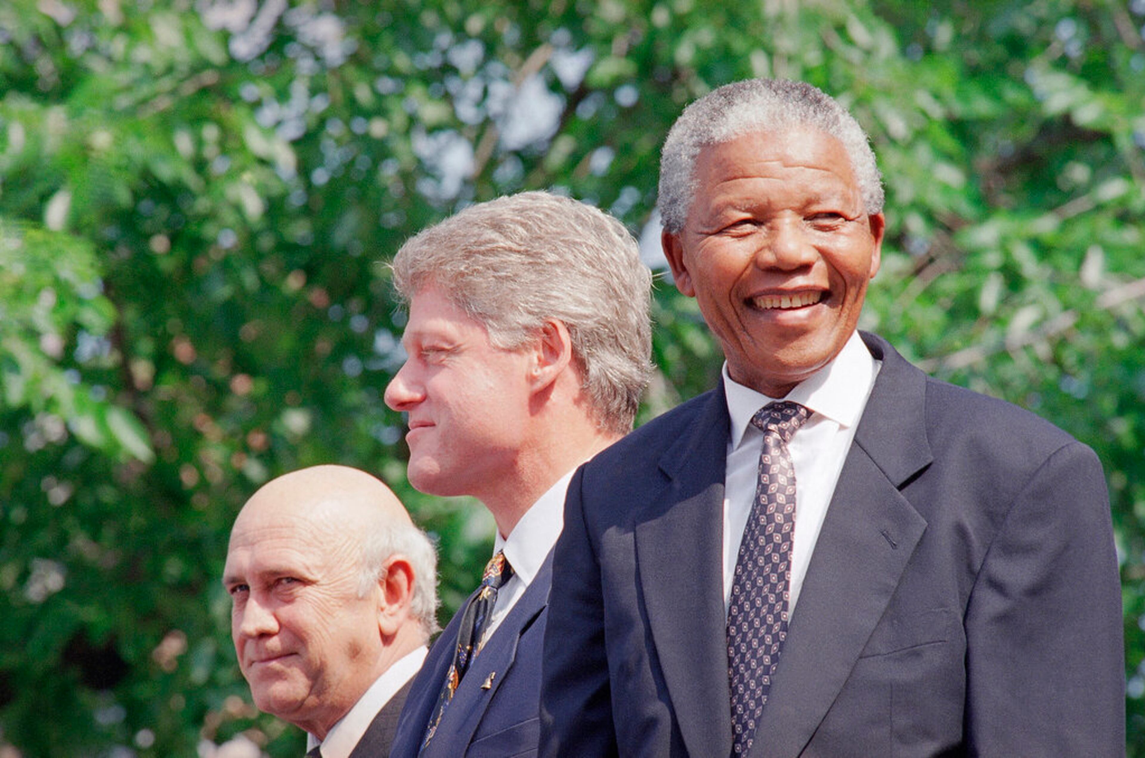 FILE - In this July 4, 1993 file photo, from left, F.W. de Klerk, President Bill Clinton, and Nelson Mandela appear at ceremonies honoring the two South African leaders with the Philadelphia Liberty Medal at Independence Hall in Philadelphia. (AP Photo/Greg Gibson)