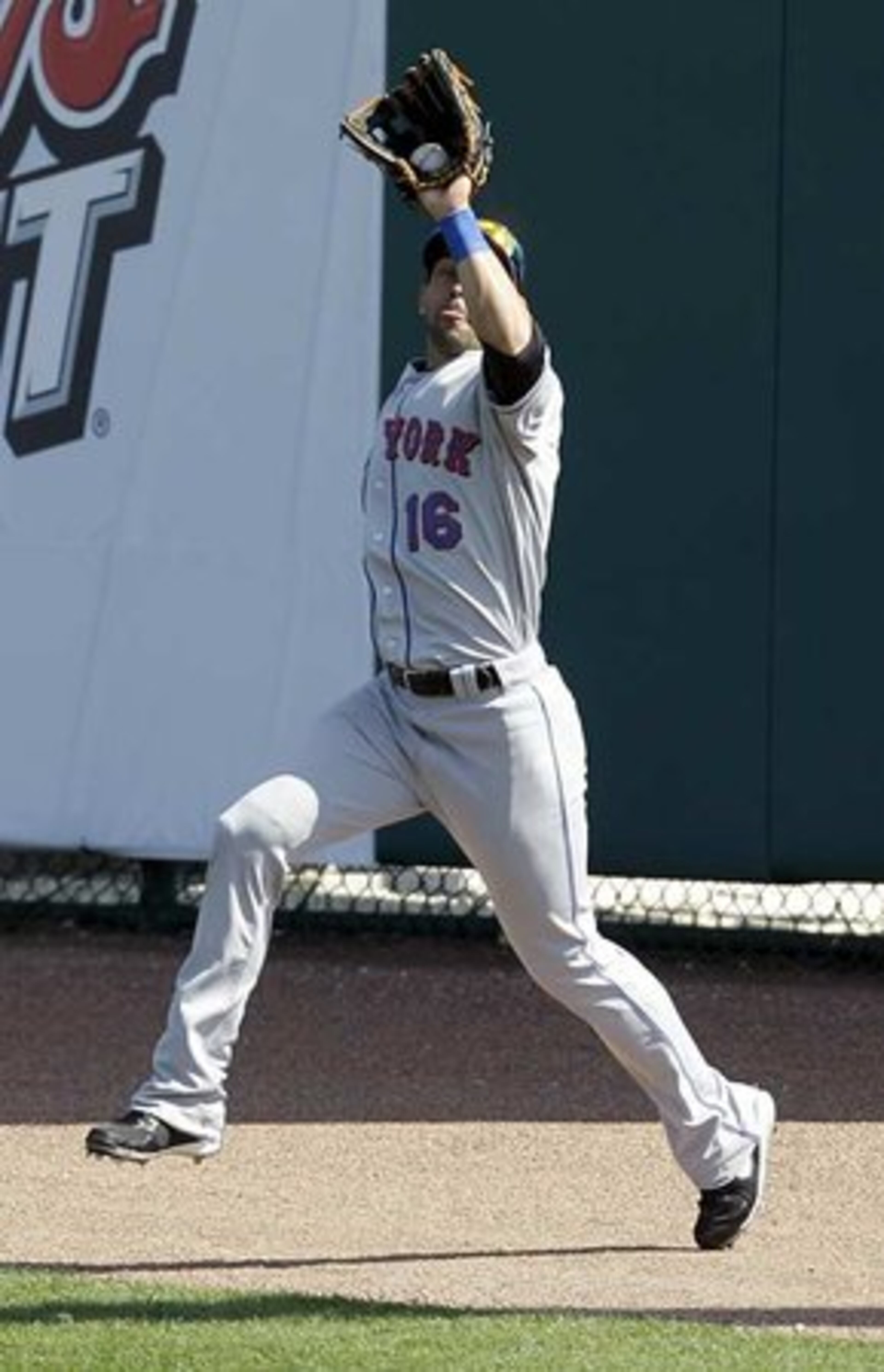 Mets center fielder Angel Pagan catches a ball hit by Atlanta's Brent Clevlen for an out to end the fifth inning. The Braves hammered New York 9-5 in the second spring game between the teams.