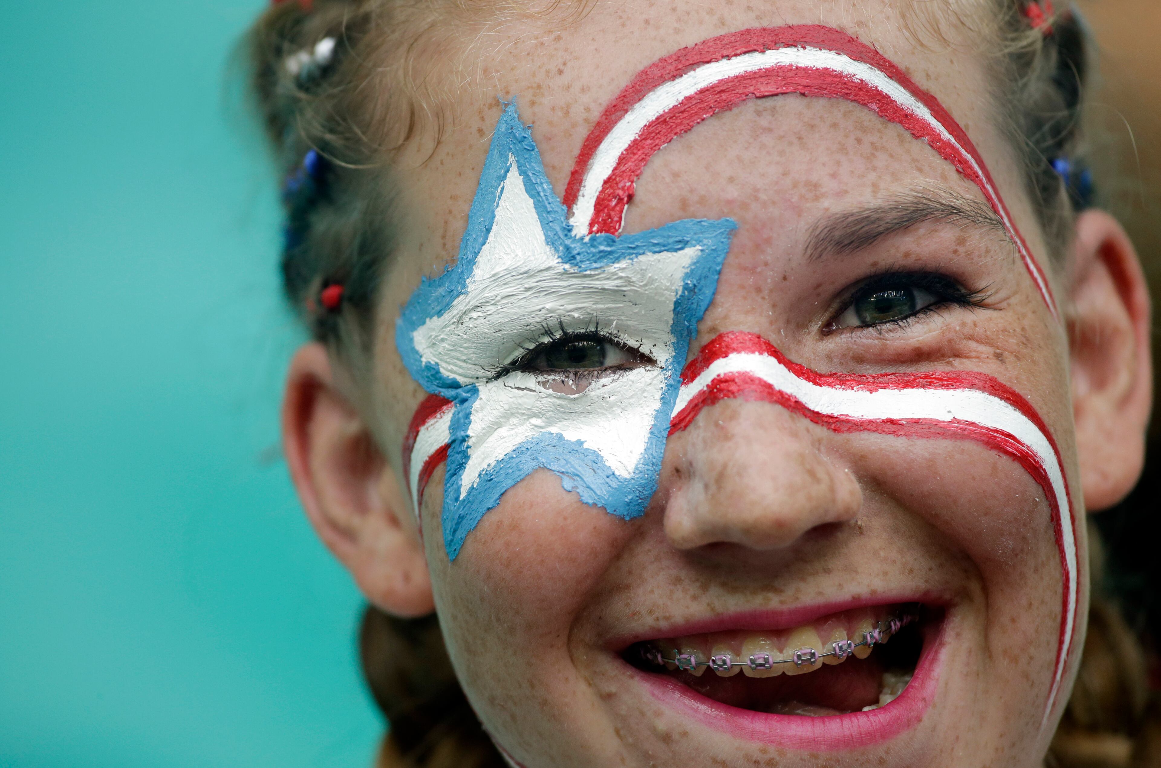 A US fan waits for the beginning of the World Cup round of 16 soccer match between Belgium and the USA at the Arena Fonte Nova in Salvador, Brazil, Tuesday, July 1, 2014. (AP Photo/Felipe Dana)