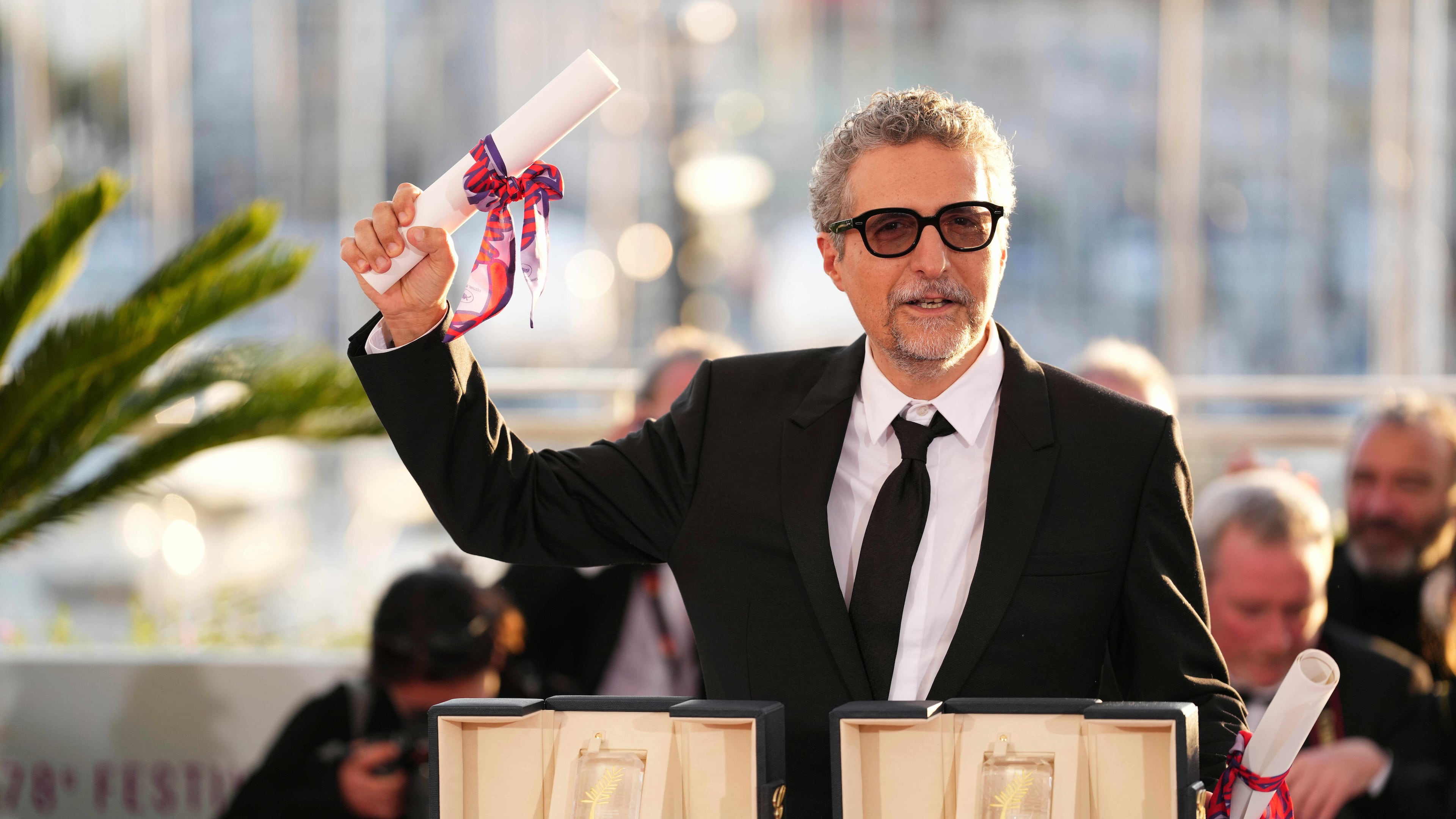 FILE - Director Kleber Mendonca Filho poses with his award for best director for the film "The Secret Agent" as well as the best actor award received on behalf of Wagner Moura at the awards ceremony photo call at the 78th international film festival, Cannes, France, May 24, 2025. (Photo by Scott A Garfitt/Invision/AP, File)