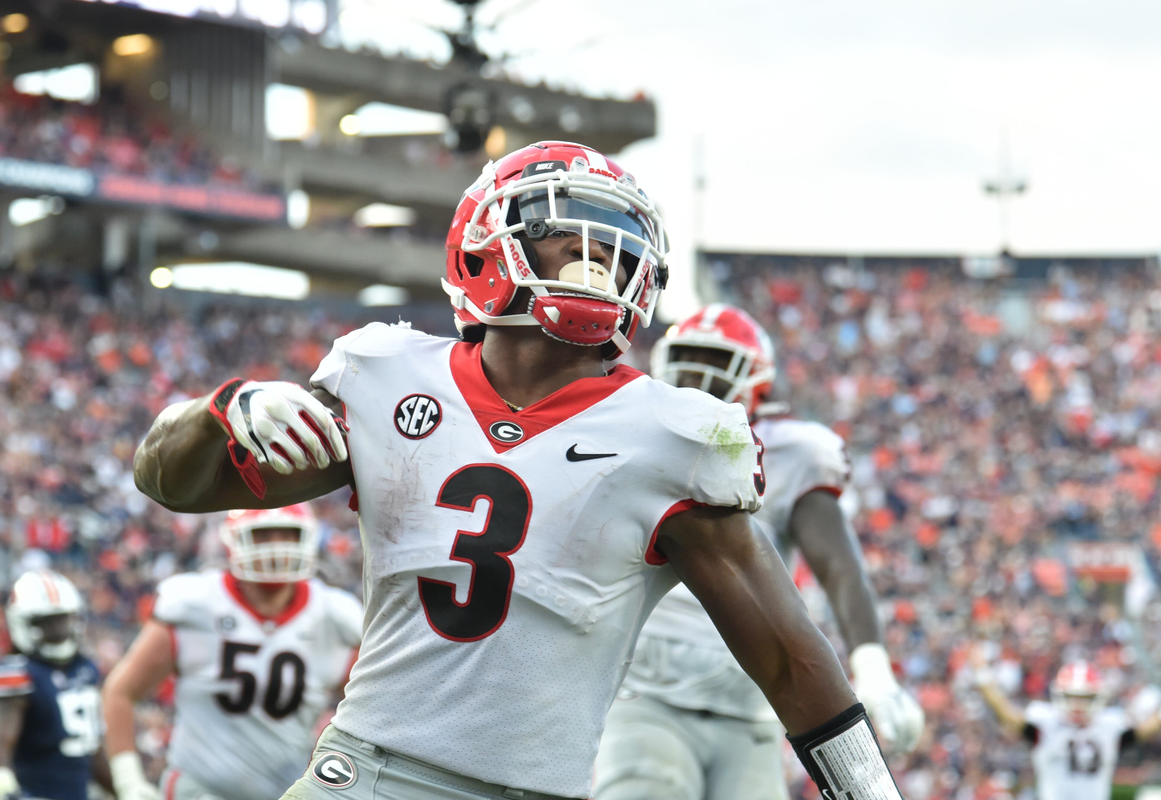Georgia running back Zamir White (3) celebrates after scoring a touchdown during the second half. Georgia won 34-10 over Auburn. (Hyosub Shin / Hyosub.Shin@ajc.com)