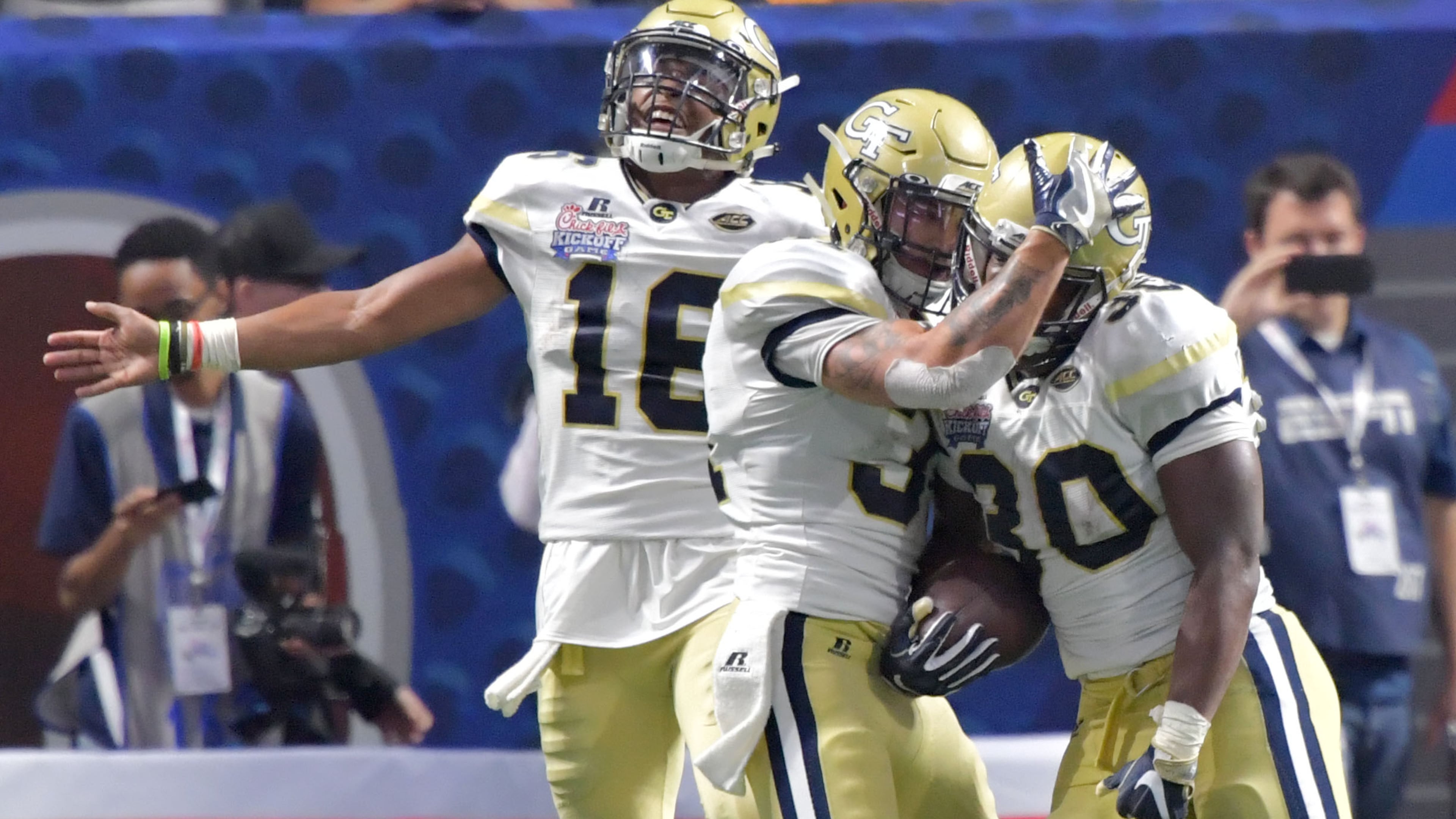 Georgia Tech running back KirVonte Benson (30) celebrates with teammates after he scored a a touchdown in the first half of NCAA college football game at the Mercedes-Benz Stadium on Monday, September 4, 2017. HYOSUB SHIN / HSHIN@AJC.COM