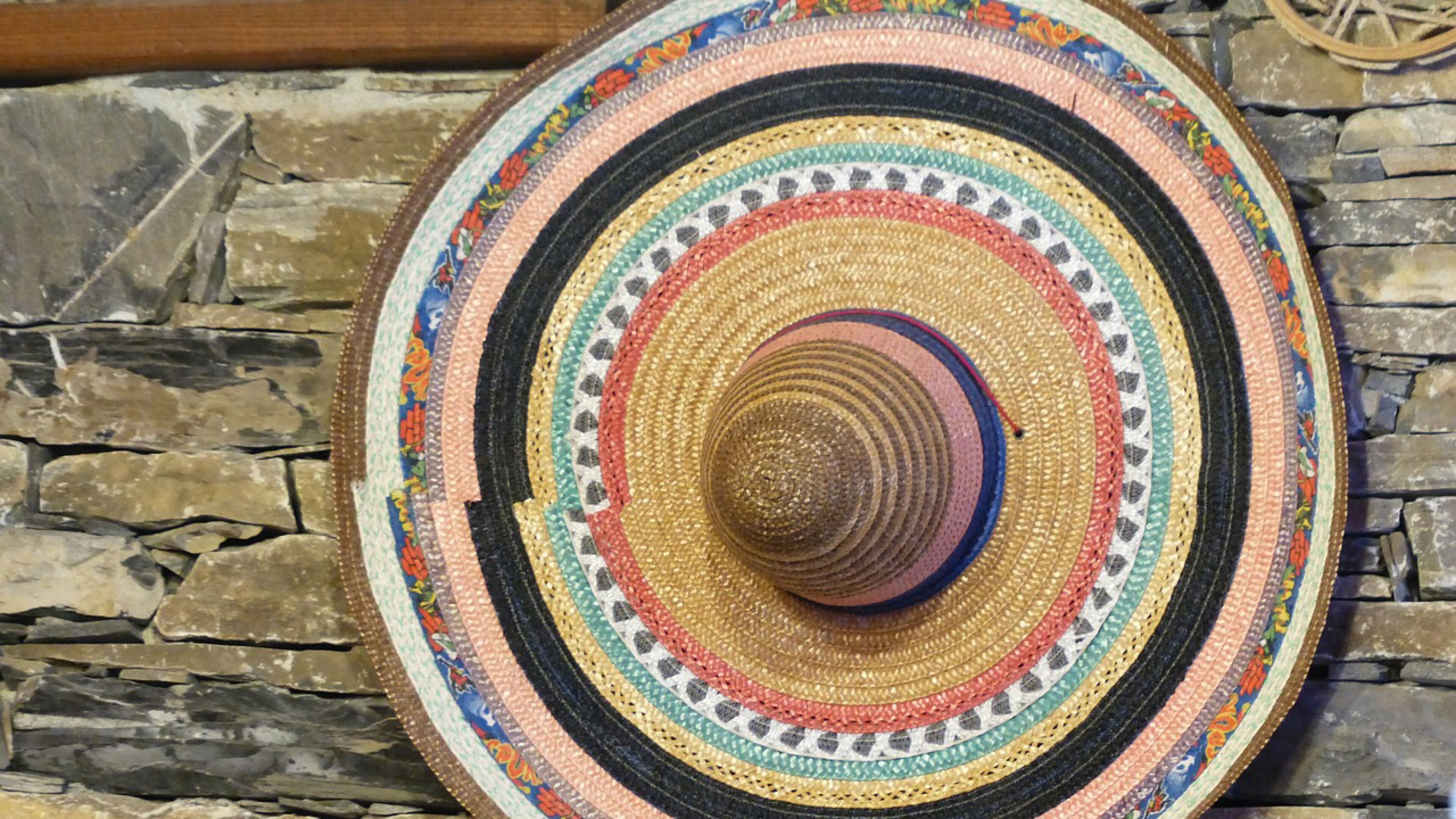 A colorful sombrero hangs on a wall. Teachers at a California high school sparked a controversy when they donned sombreros and mustaches for their yearbook photos.