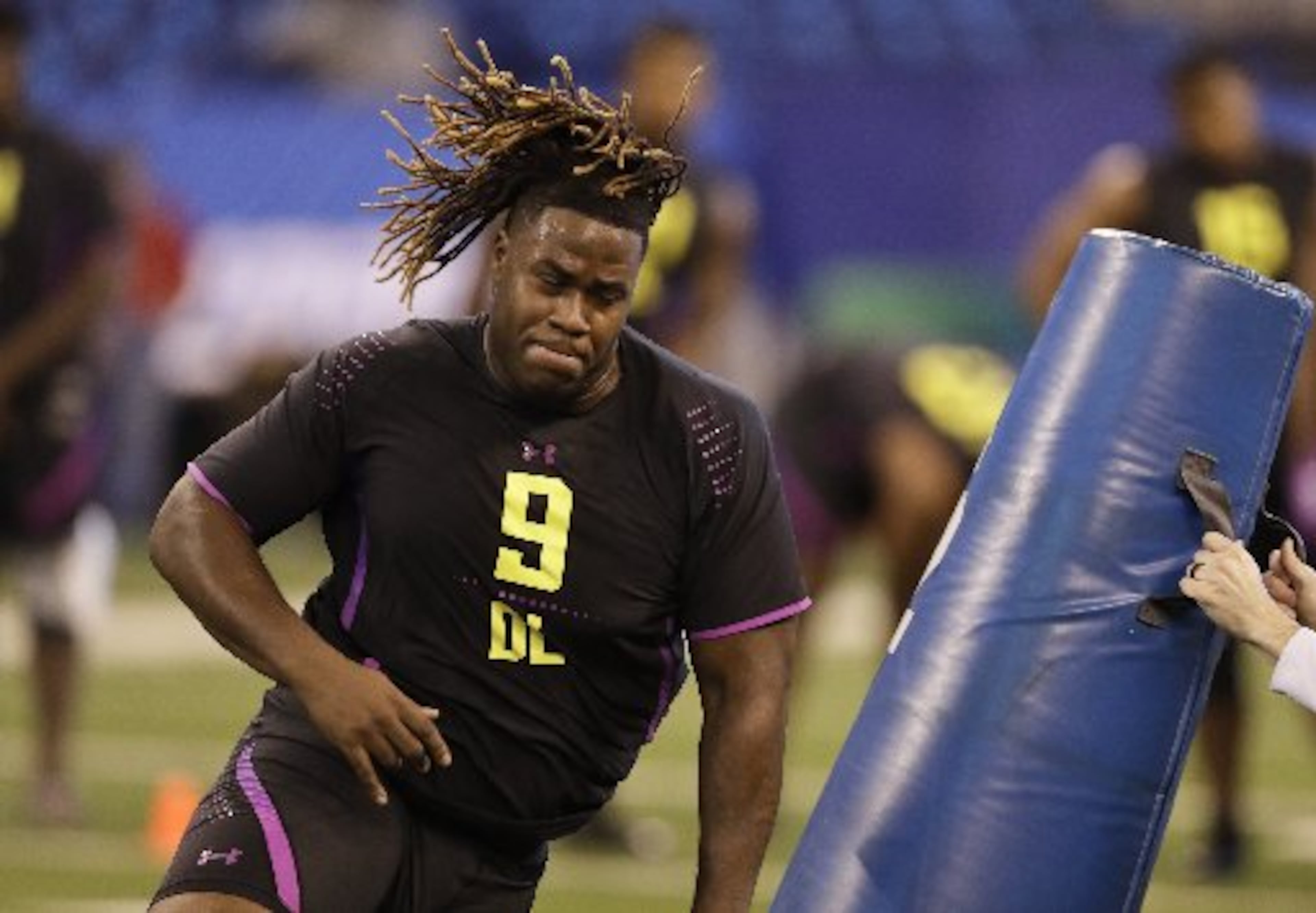 North Carolina State defensive lineman Justin Jones runs a drill during the NFL football scouting combine, Sunday, March 4, 2018, in Indianapolis. (AP Photo/Darron Cummings)