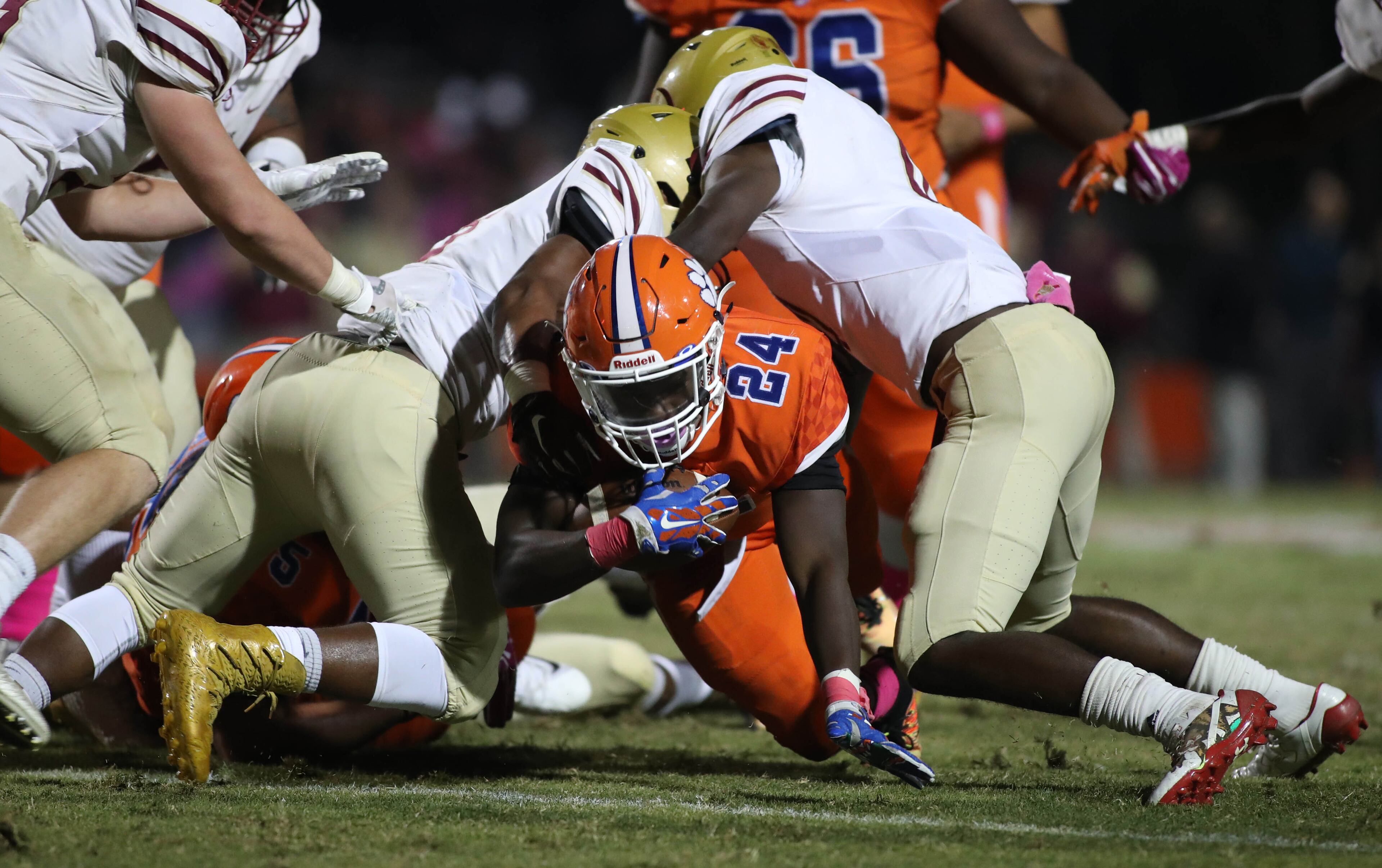 October 20, 2017 - Lilburn, Ga: Parkview running back Christian Malloy (24) fights for extra yards against Brookwood defenders in the first half of their game at Parkview High School Friday, October 20, 2017, in Lilburn, Ga.. PHOTO / JASON GETZ