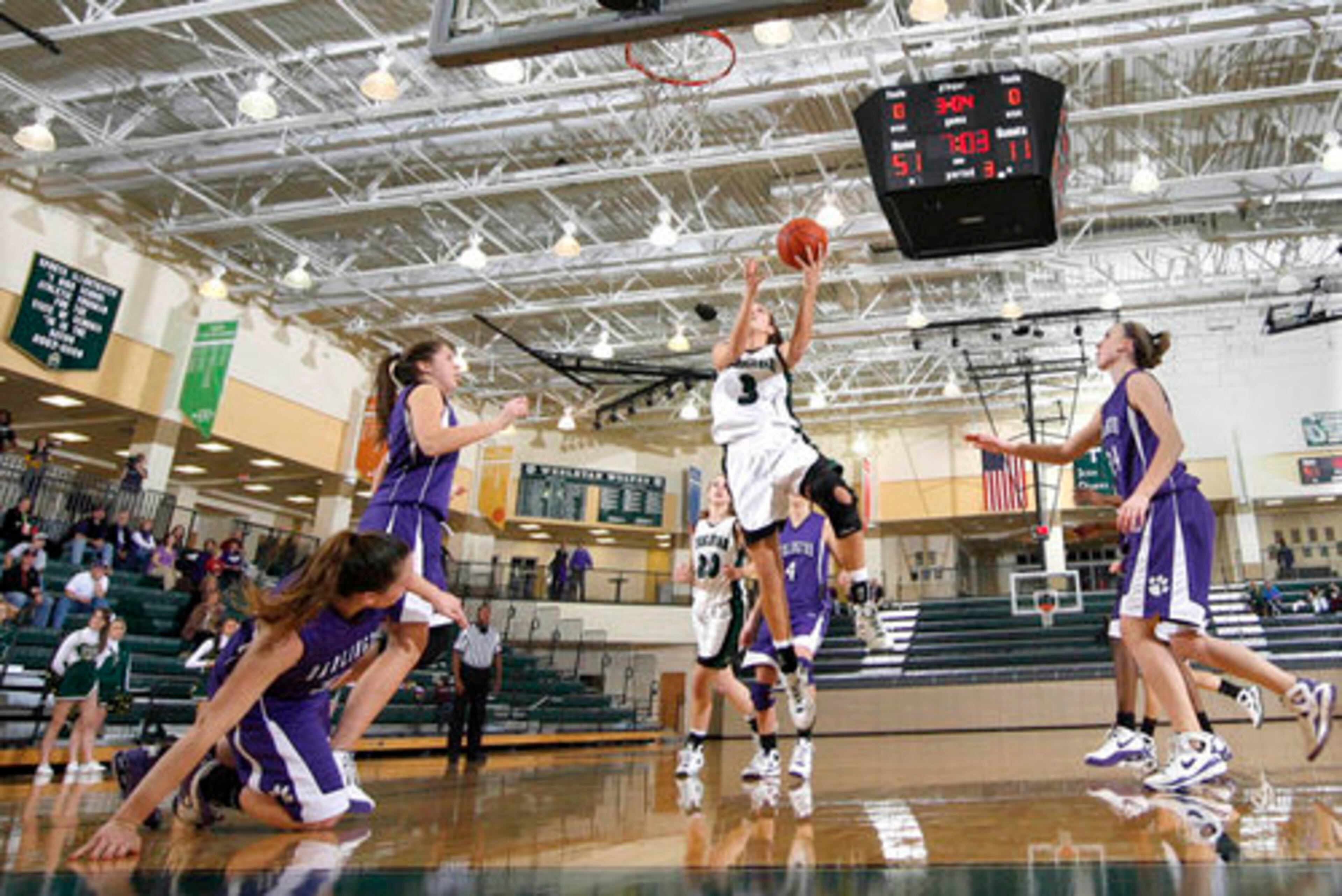 Wesleyan senior Anne Marie Armstrong (3) splits the Darlington defense to score a bucket .