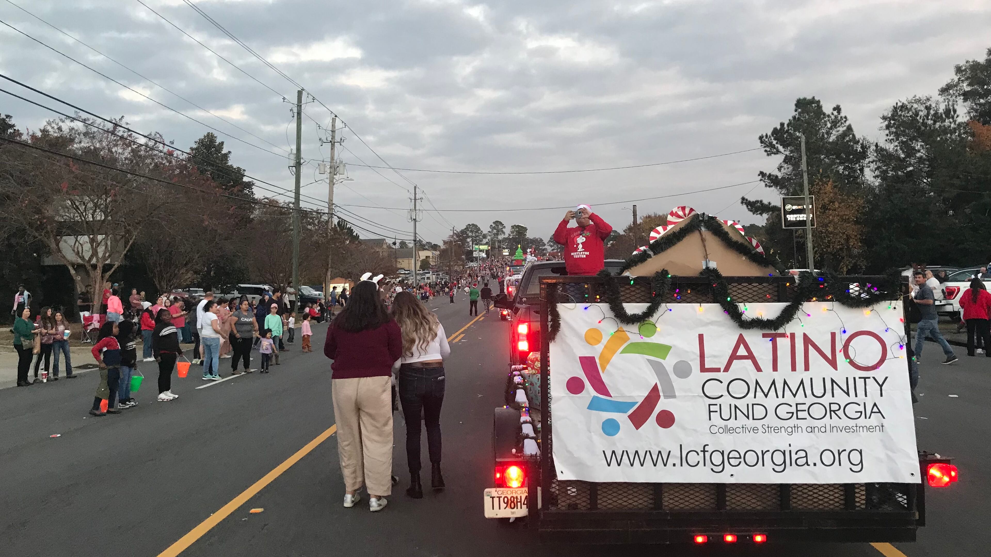 The Latino Community Fund takes part in a Christmas parade in the town of Tifton in South Georgia on Saturday, December 4, 2021.