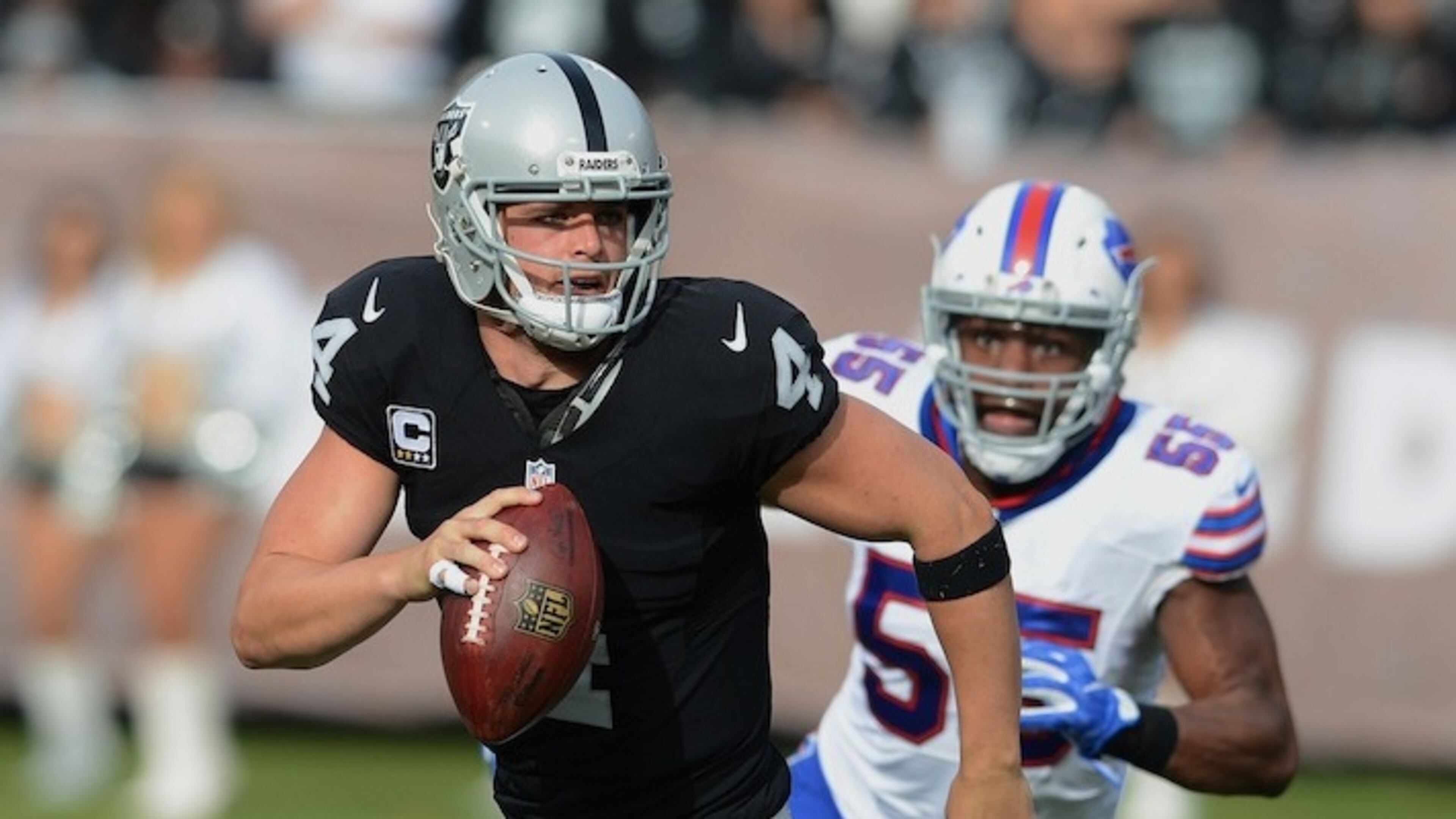 The Oakland Raiders' Derek Carr (4) rolls out against the Buffalo Bills on Sunday, Dec. 4, 2016, at the Oakland Coliseum in Oakland, Calif. (Dan Honda/Bay Area News Group/TNS)