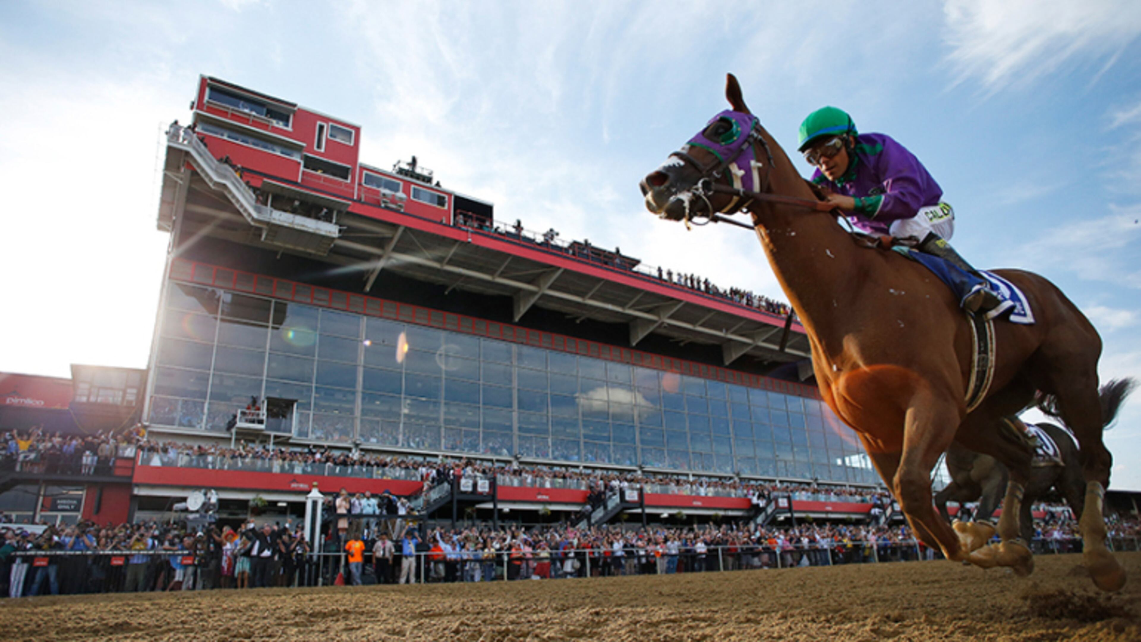 California Chrome, ridden by jockey Victor Espinoza, wins the 139th Preakness Stakes horse race at Pimlico Race Course, Saturday, May 17, 2014, in Baltimore. (AP Photo/Matt Slocum)