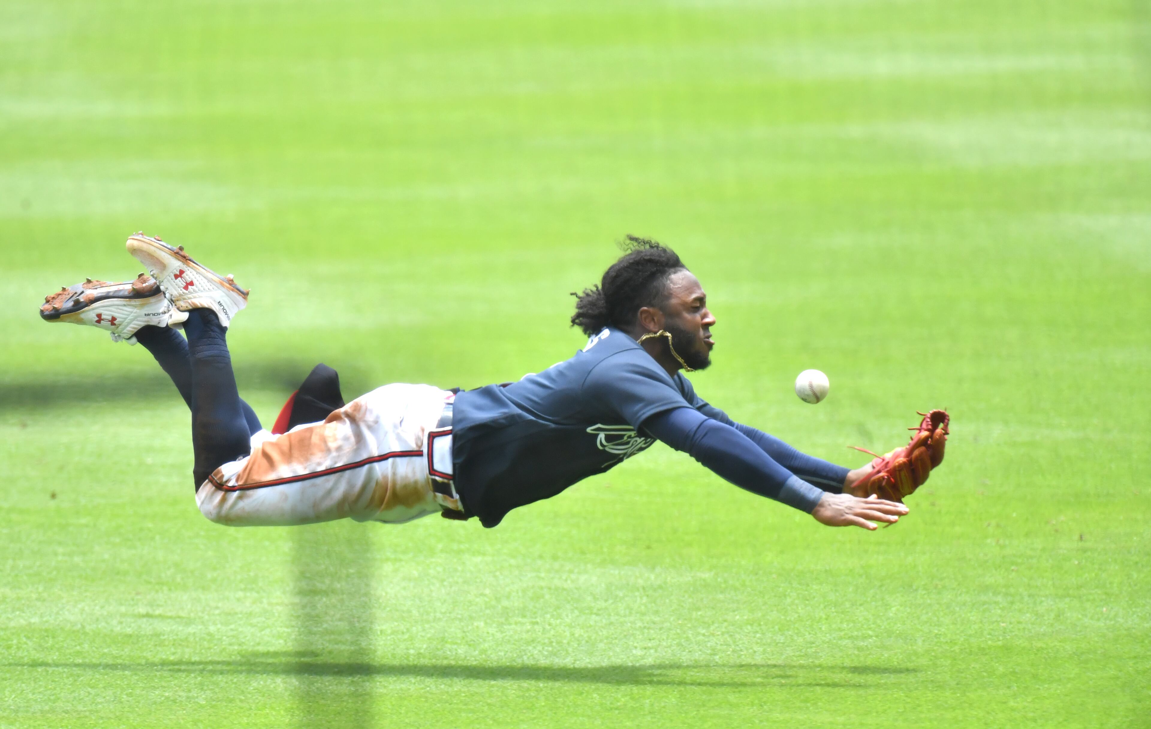 Braves second baseman Ozzie Albies goes all out but can't reach a ball during a team scrimmage in Truist Park on Wednesday. (Hyosub Shin / Hyosub.Shin@ajc.com)