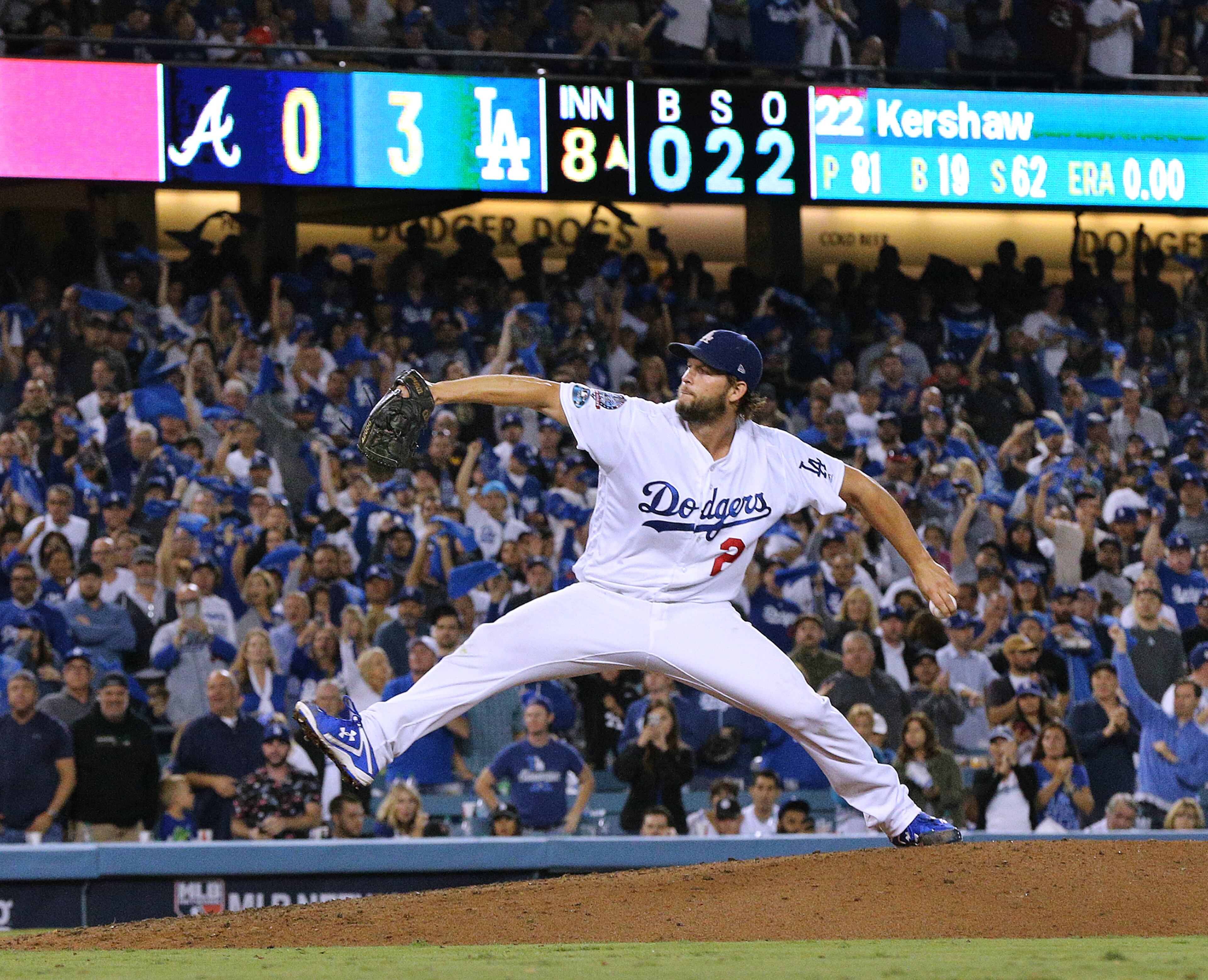 October 5, 2018 Los Angeles: Los Angeles Dodgers pitcher Clayton Kershaw delivers a pitch against the Atlanta Braves during the 8th inning in Game 2 of a National League Division Series baseball game on Friday, Oct 5, 2018, in Los Angeles. Kershaw threw 8 shutout innings in the 3-0 victory over the Braves. Curtis Compton/ccompton@ajc.com