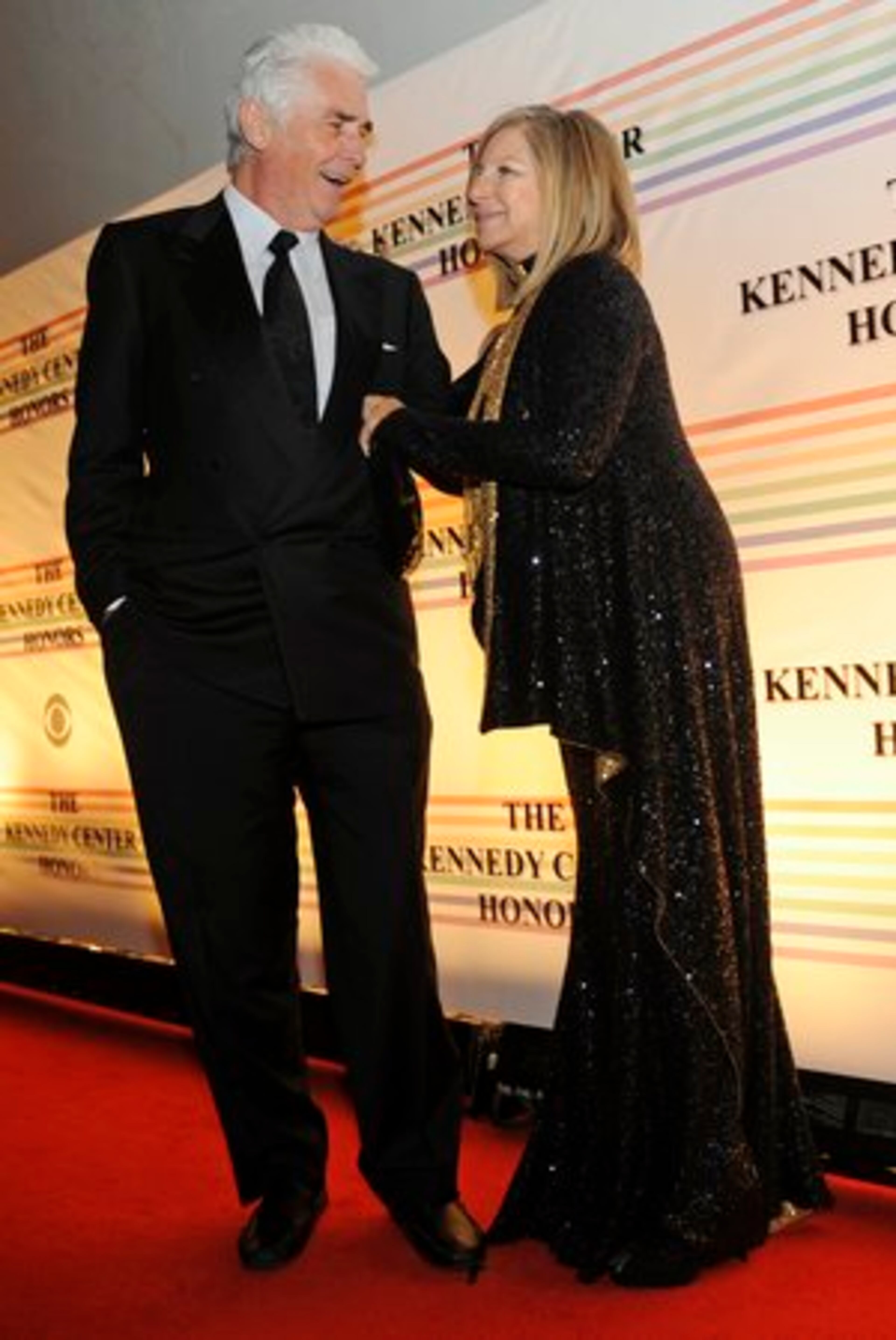 Streisand arrives with her, husband James Brolin. Longtime Democrat and President Bush shared an awkward peck on the cheek during the gala. "Art transcends politics this weekend," she said.