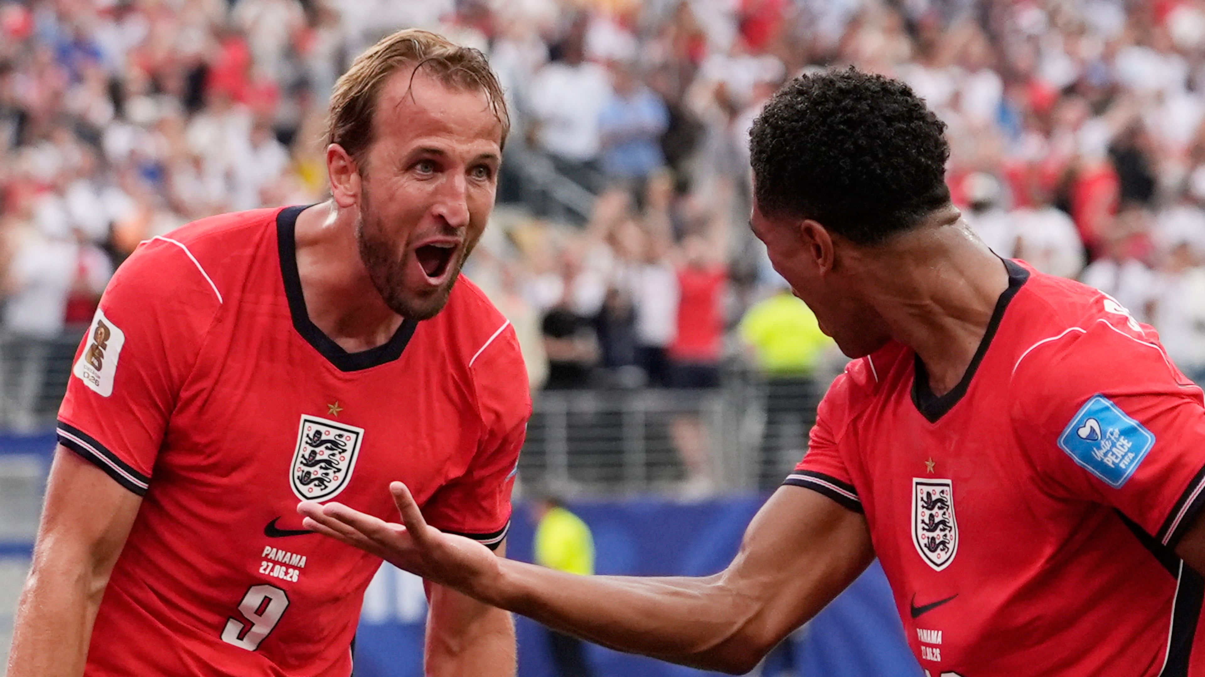 England's Harry Kane (9) celebrates with England's Jude Bellingham (10) after scoring their second goal during the World Cup Group L soccer match between Panama and England in East Rutherford, N.J., near New York, Saturday, June 27, 2026. (AP Photo/Steve Luciano)