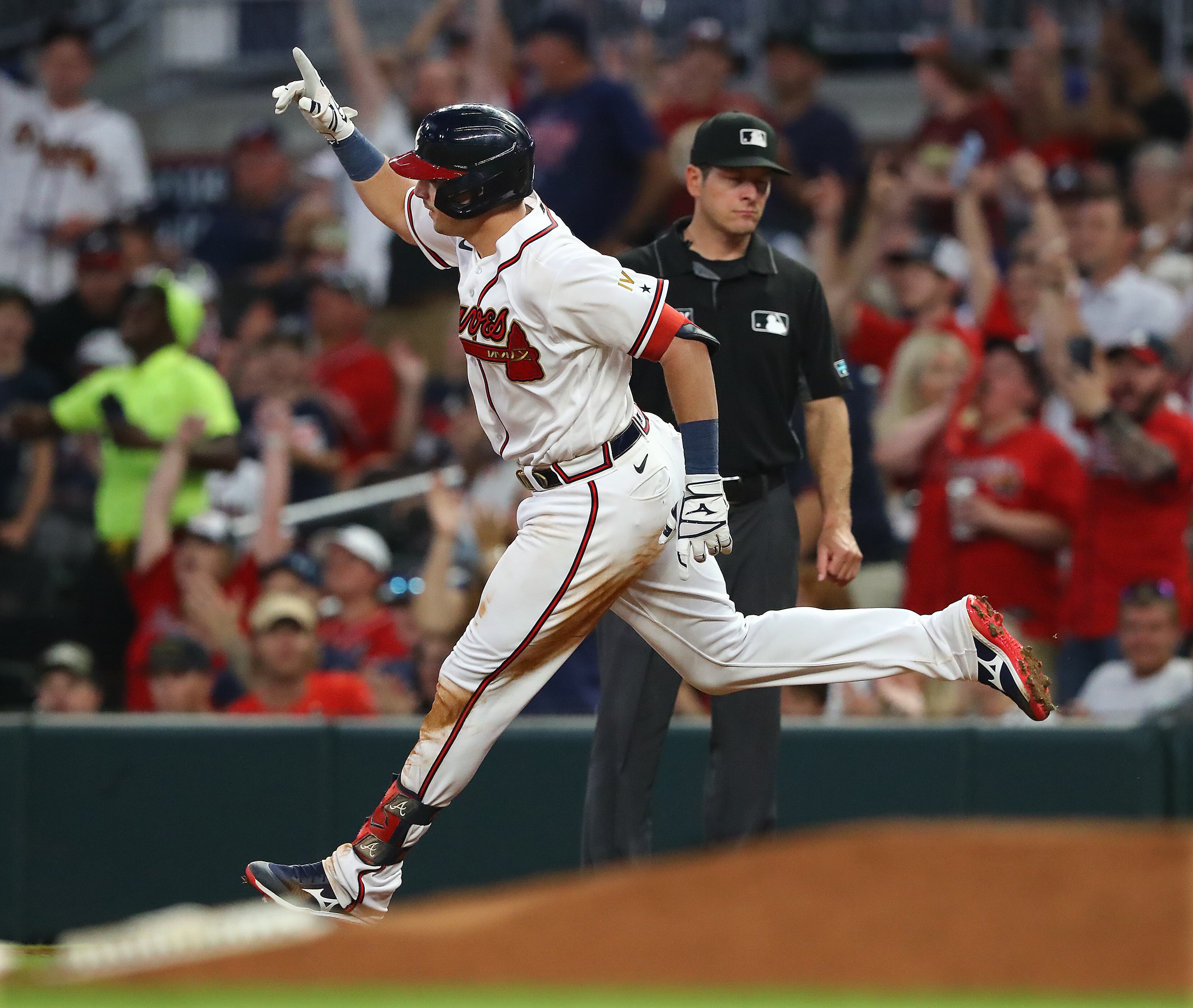 Atlanta Braves third baseman Austin Riley celebrates rounding first base after hitting a two-run homer to give his team a 5-2 lead over the Oakland Athletics during the fifth inning of an MLB game on Wednesday, June 8, 2022, in Atlanta. (Curtis Compton / Curtis.Compton@ajc.com)