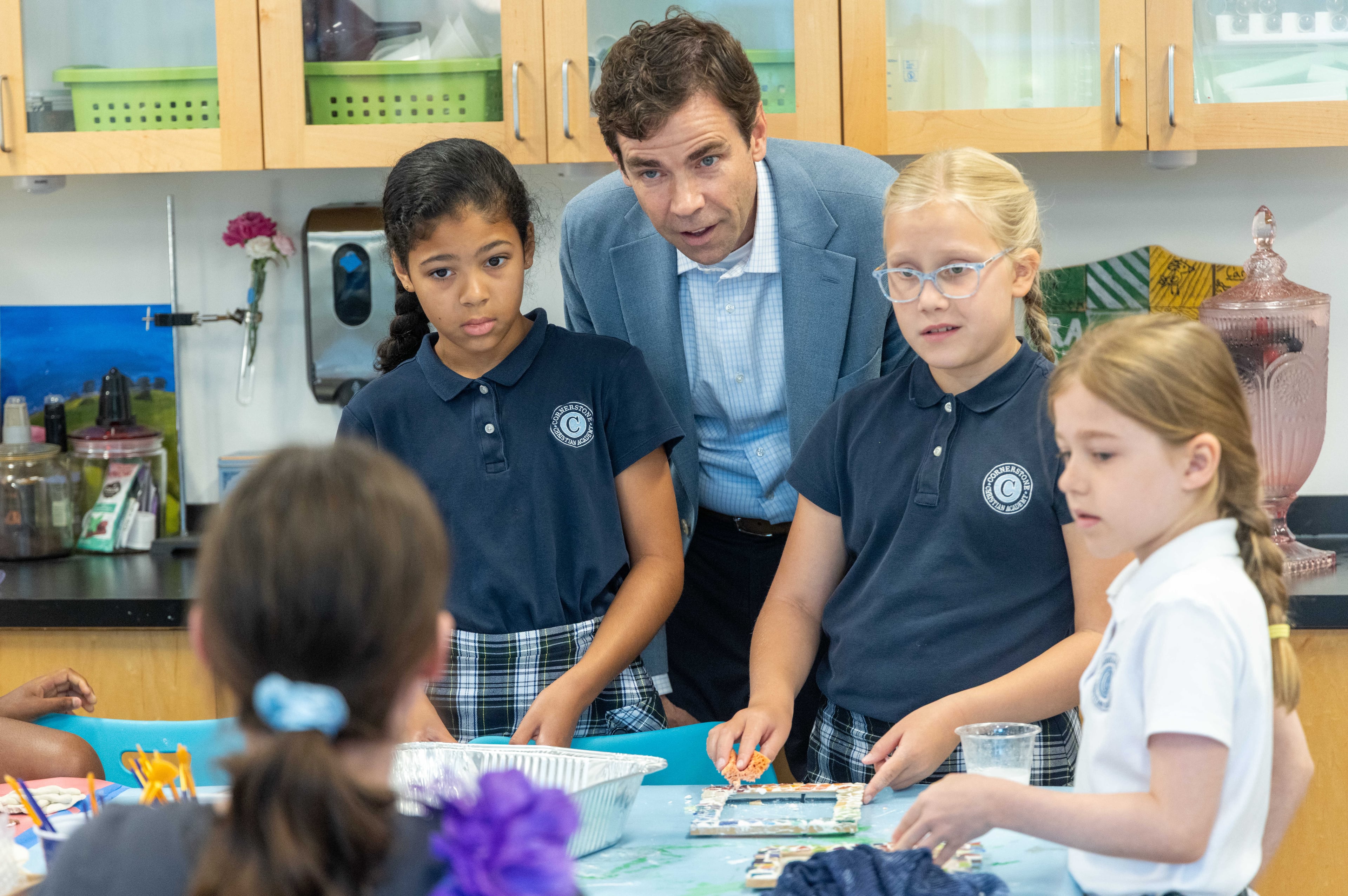 Colin Creel (center), headmaster of Cornerstone Christian Academy
