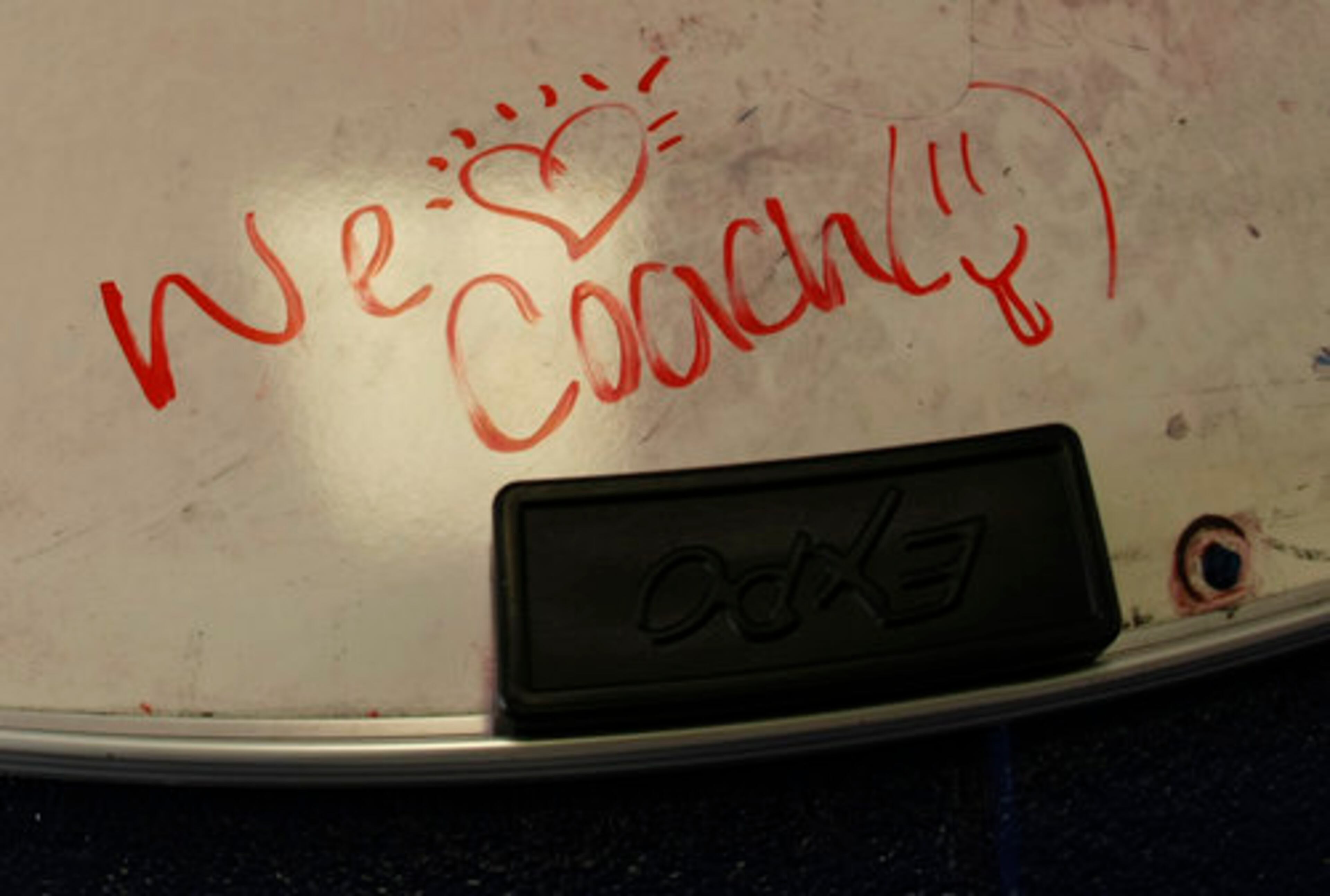 A football player has scribled a note on the chalk board in the team locker room for head coach Jeremy Williams.