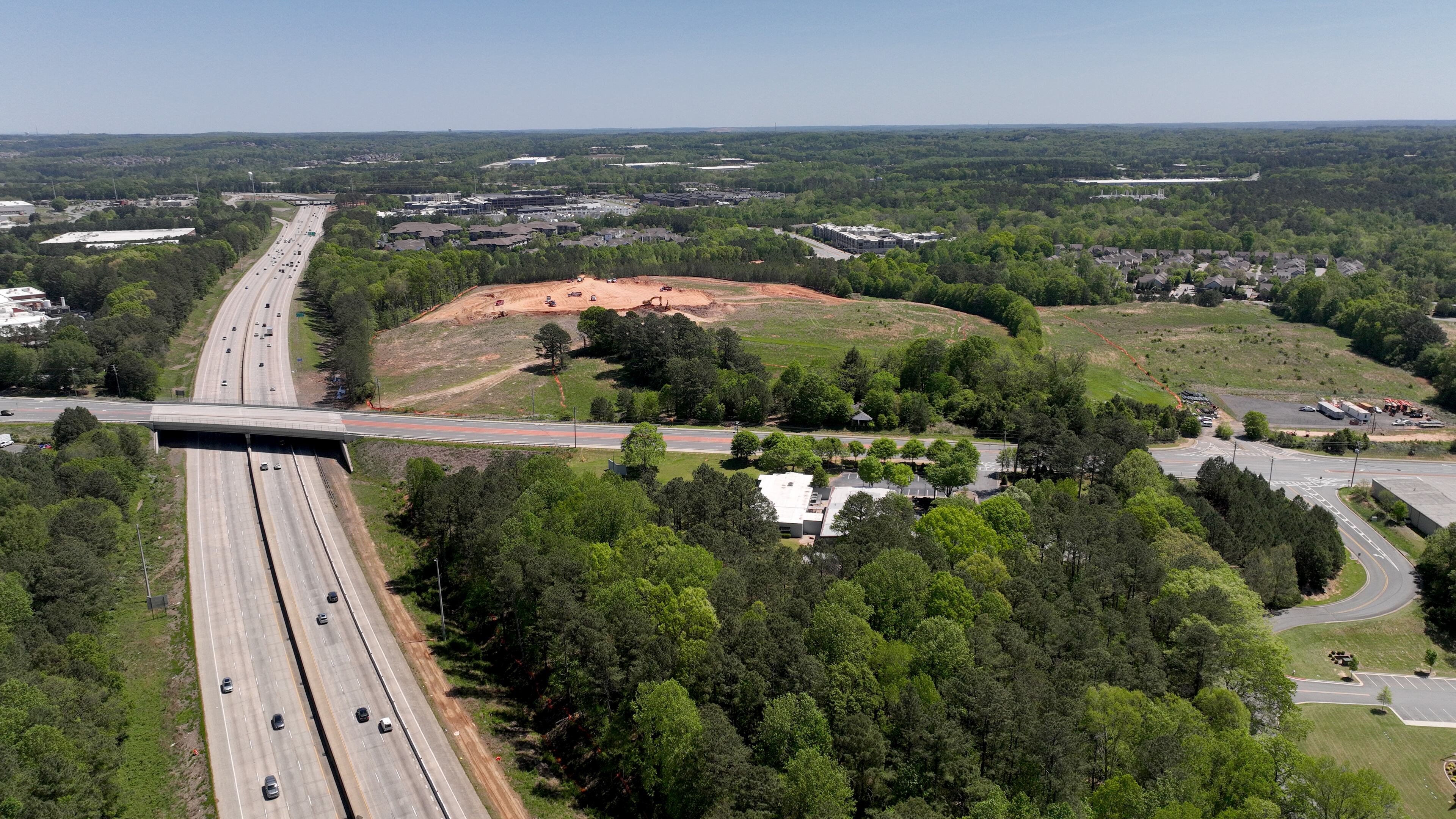 Aerial photograph shows a proposed mixed-use development and arena with the goal of bringing a NHL franchise back to metro Atlanta, along Ga. 400 (left), Tuesday, April 18, 2023, in Alpharetta. The project, called The Gathering at South Forsyth, aims to transform roughly 100 acres along Ga. 400 into an entertainment hub centered around an 18,000-seat arena. (Hyosub Shin / Hyosub.Shin@ajc.com)