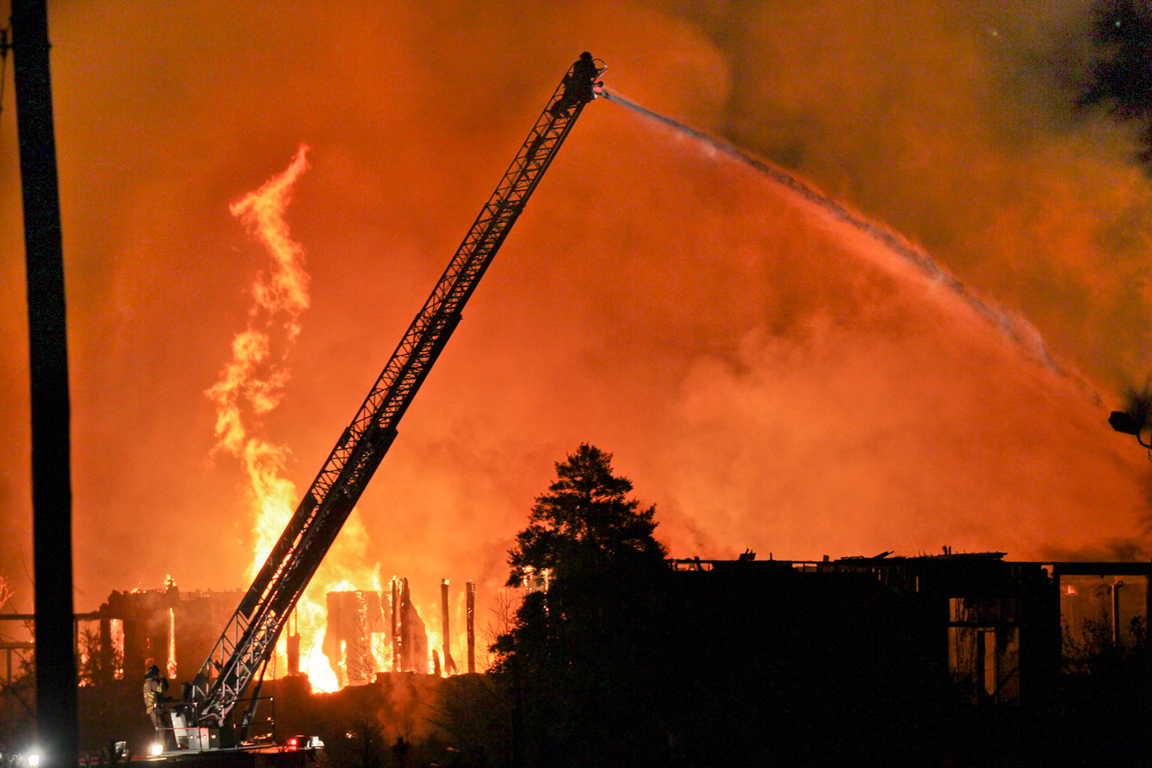 December 13, 2012 South Fulton County: A massive fire raged Thursday morning, Dec.13, 2012 in south Fulton County as an abandoned county building burned near Hartsfield-Jackson Atlanta International Airport. The old Fulton County Public Safety Training Academy was burning as early as 5:30 a.m., near the intersection of Roosevelt Highway and Washington Road. No injuries have been reported and there was no impact on flights, authorities said. From miles away, the orange glow from the blaze could be seen in the early morning dark, and a thick black plume of smoke could be seen rising into the air. Flames jumped as high as 10 feet above the building and smoke from the blaze rose into the pathway of incoming planes landing at Hartsfield. Fulton County Fire Department Deputy Fire Chief Jack Butler said investigators believe the fire started outside the former elementary school. ââ¬ÅThe fire this morning it would appear started from an abandoned vehicle that was torched,ââ¬Â Butler said. ââ¬ÅThe fire actually started from the outside and worked its way to the building.ââ¬Â The L-shaped building was built in the 1940s as Campbell Elementary School, Butler said. It had been closed for four or five years, after the county stopped using it as training facility, he said. JOHN SPINK / JSPINK@AJC.COM