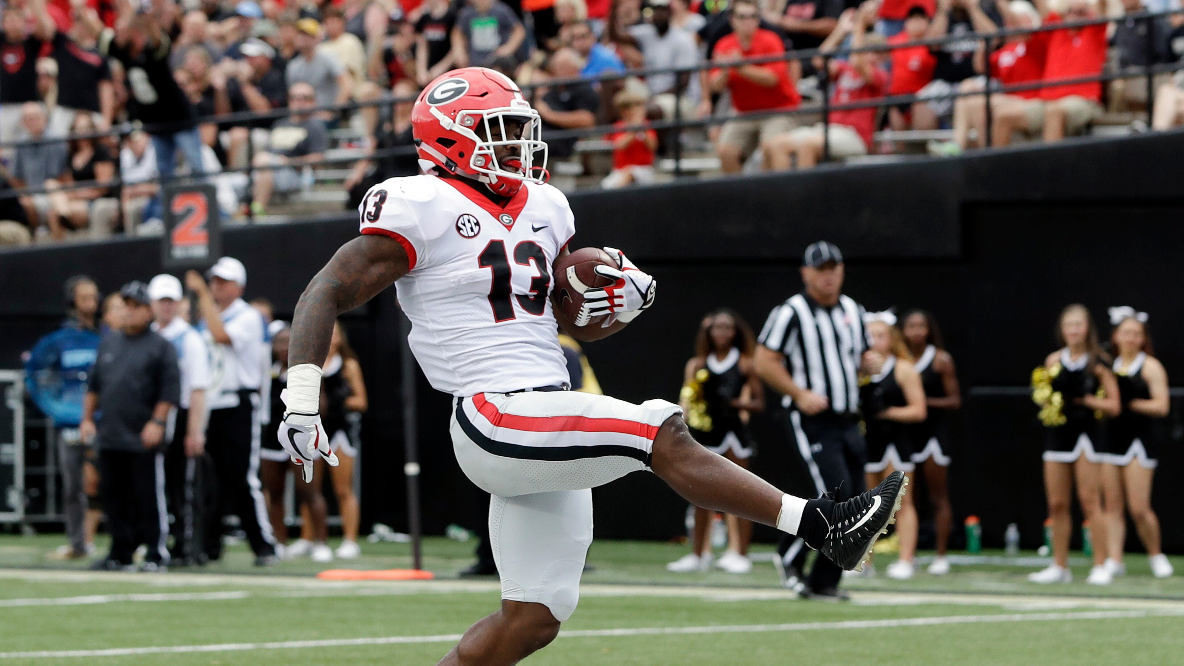 Georgia running back Elijah Holyfield scores a touchdown on a 15-yard run against Vanderbilt in the second half of an NCAA college football game Saturday, Oct. 7, 2017, in Nashville, Tenn. Georgia won 45-14. (AP Photo/Mark Humphrey)