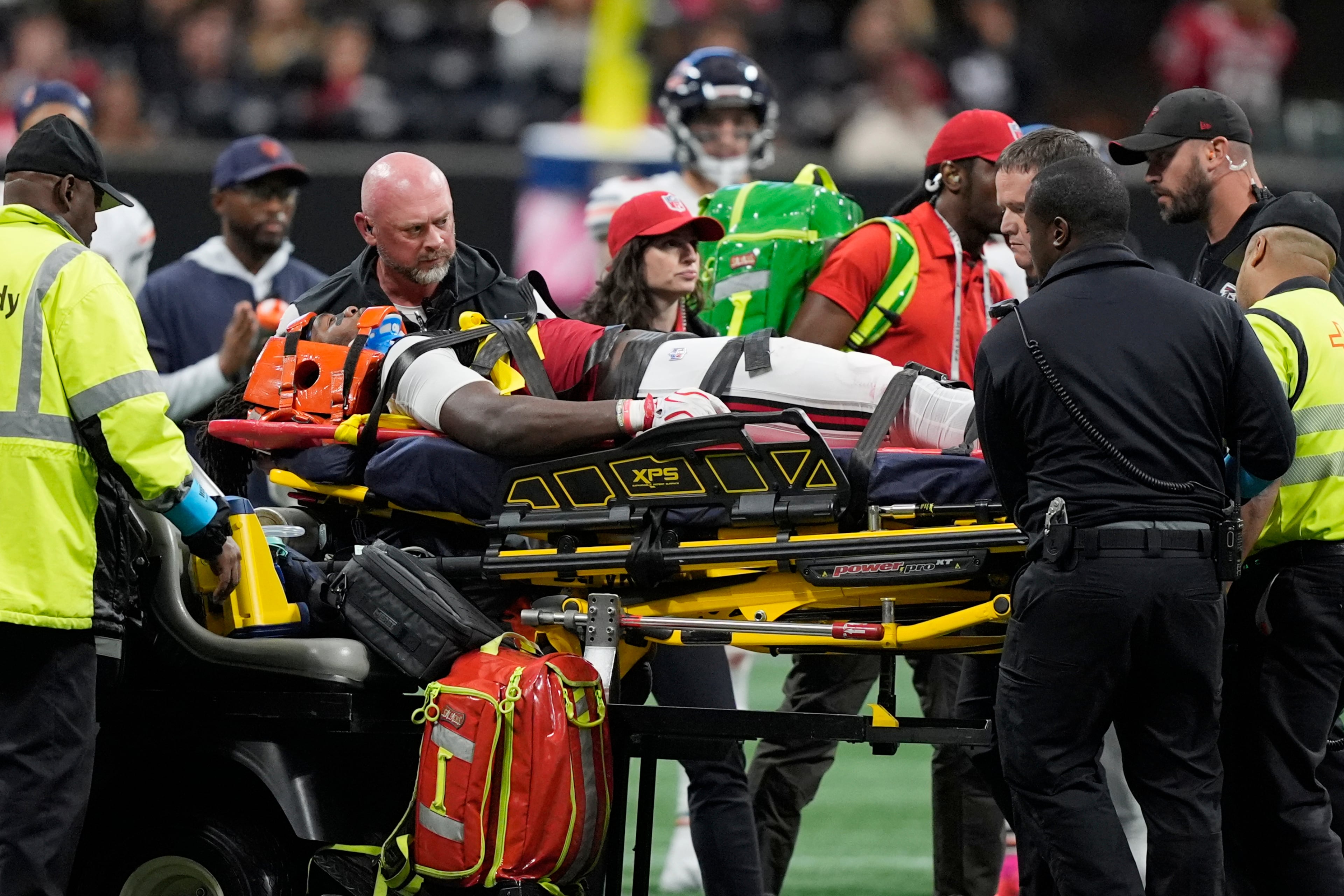 Atlanta Falcons linebacker Kendal Daniels is taken off the field after being injured during the second half of an NFL football game between the Falcons and the Chicago Bears in Atlanta, Sunday, Oct. 18, 2026. (AP Photo/Mike Stewart)