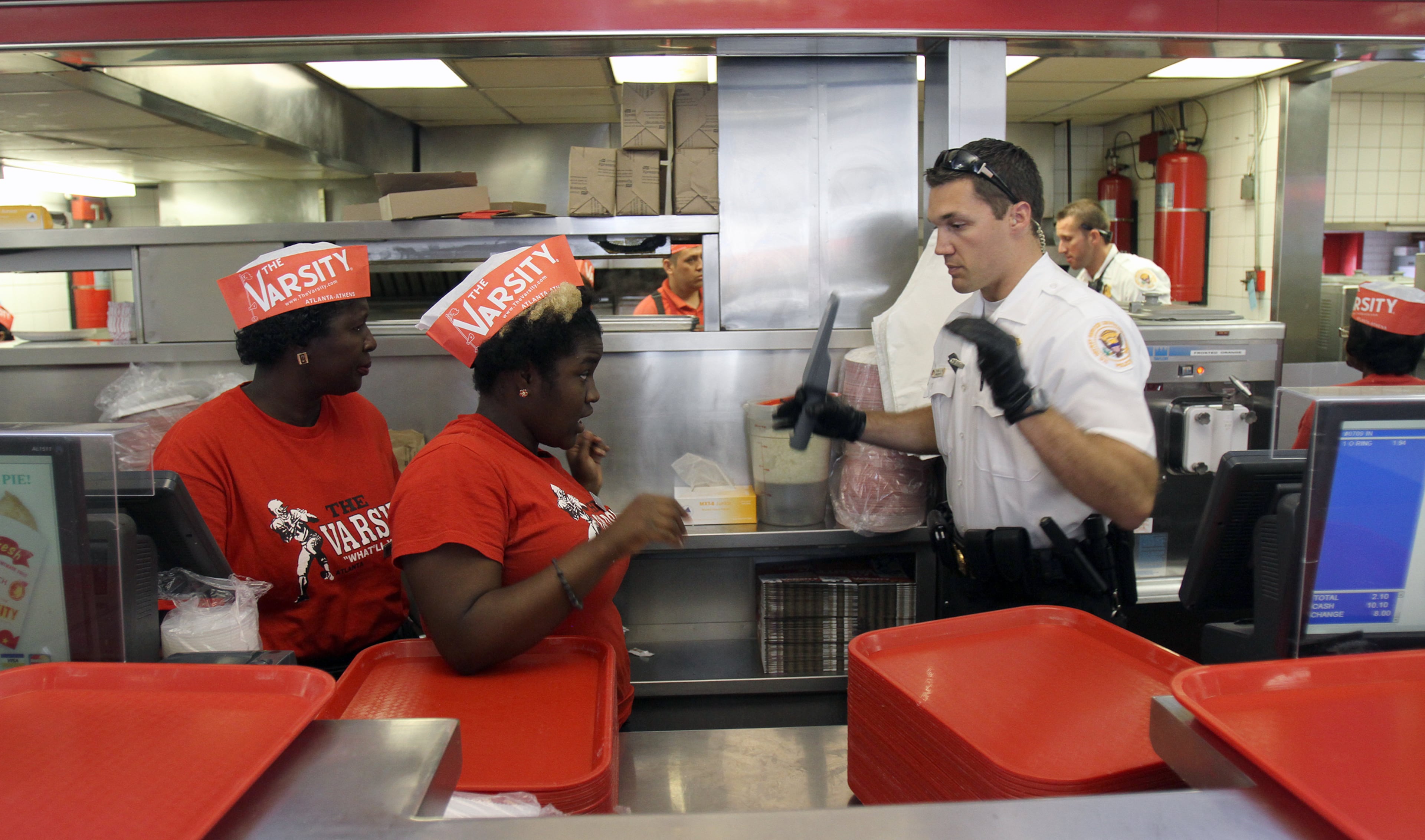June 25, 2012-Atlanta-A U.S. Secret Service screens employees before President Obama makes a stop at Varsity for hot dog en route to campaign event downtown Tuesday. VINO WONG / VWONG@AJC.COM