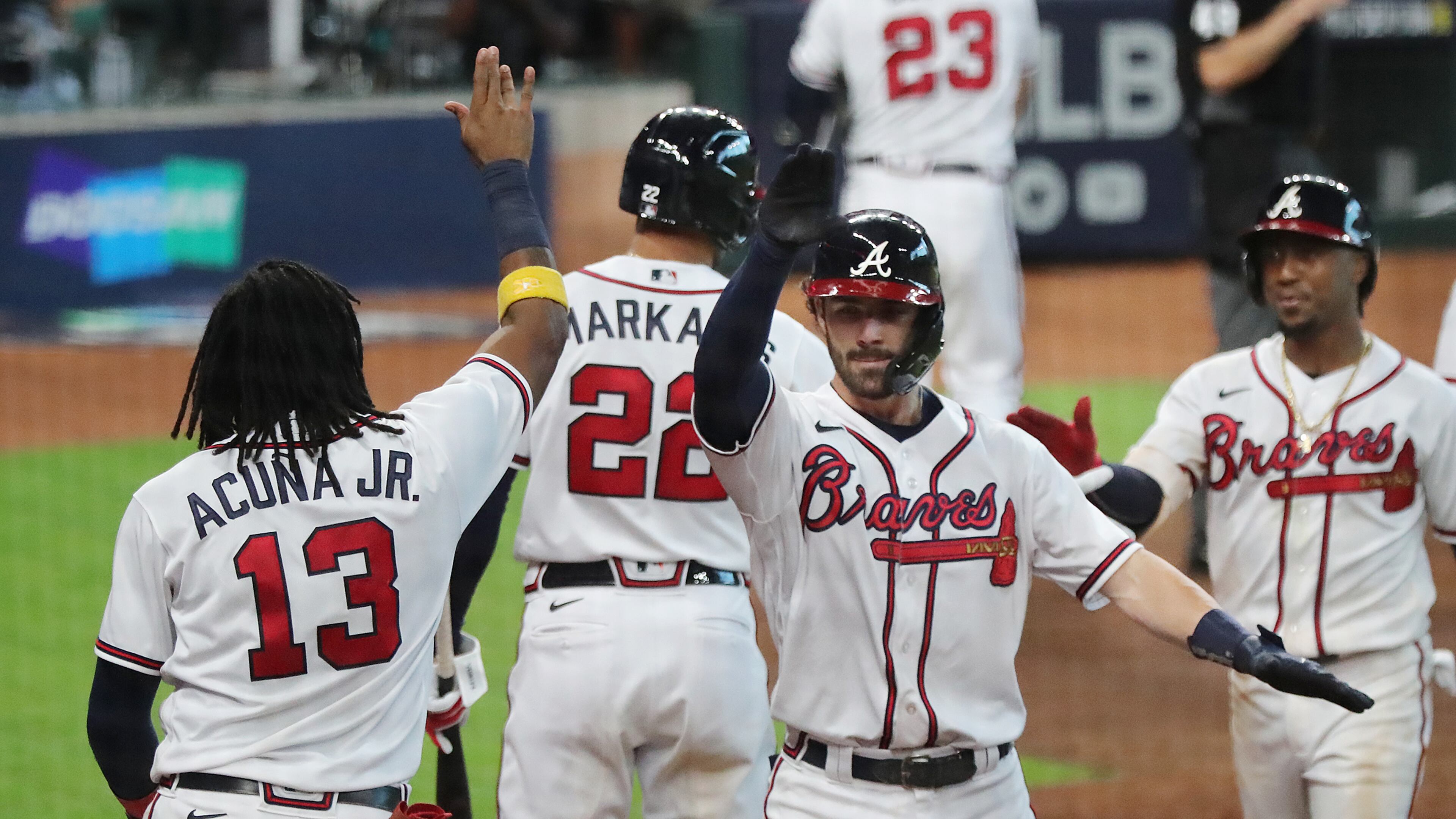 Braves celebrate taking 7-4 lead over Marlins in Game 1 of the National League Division Series Tuesday, Oct. 6, 2020, at Minute Maid Park in Houston. (Curtis Compton / Curtis.Compton@ajc.com)
