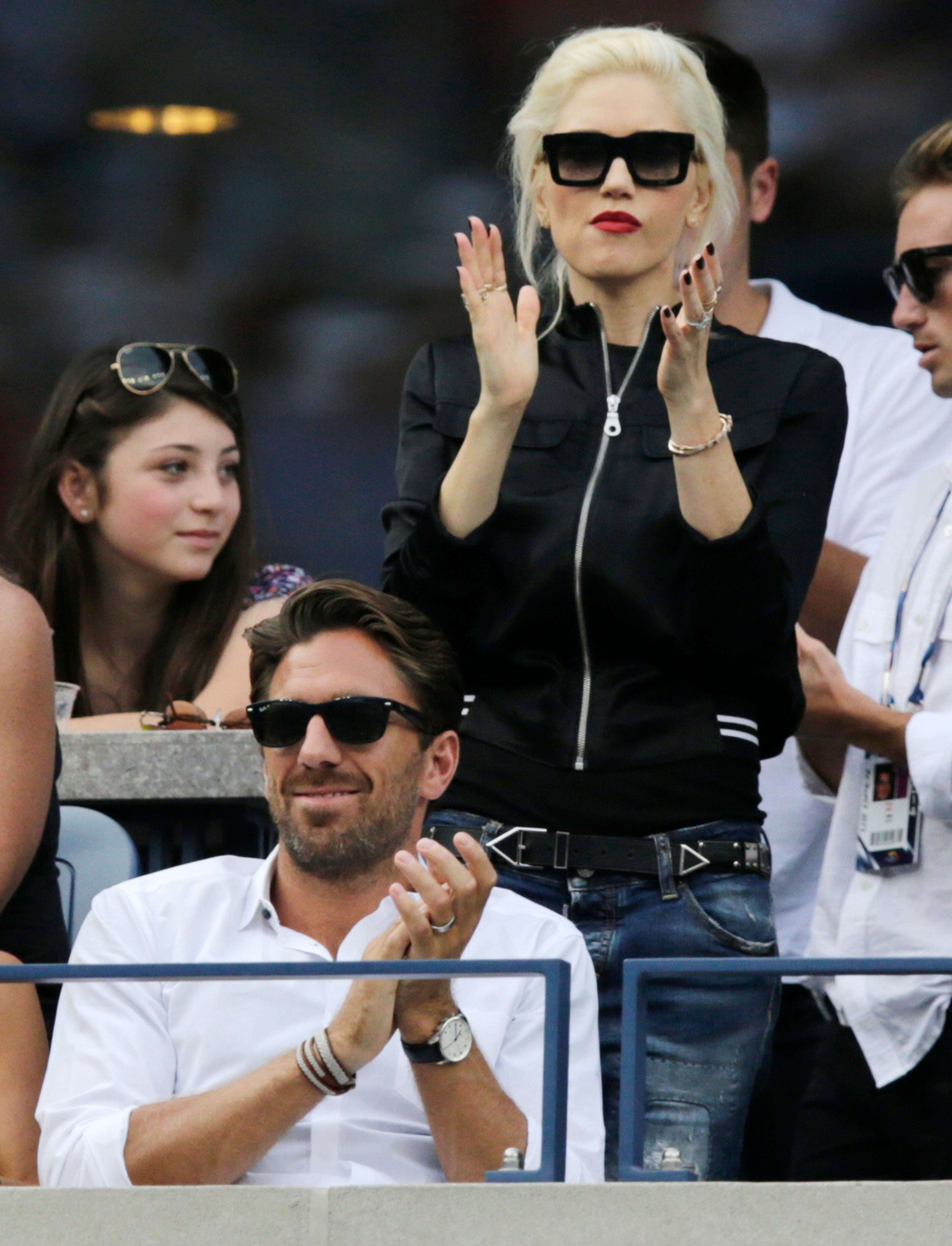 Gwen Stefani watches play between Roger Federer, of Switzerland, and Marin Cilic, of Croatia, during the semifinals of the 2014 U.S. Open tennis tournament, Saturday, Sept. 6, 2014, in New York. (AP Photo/Charles Krupa)