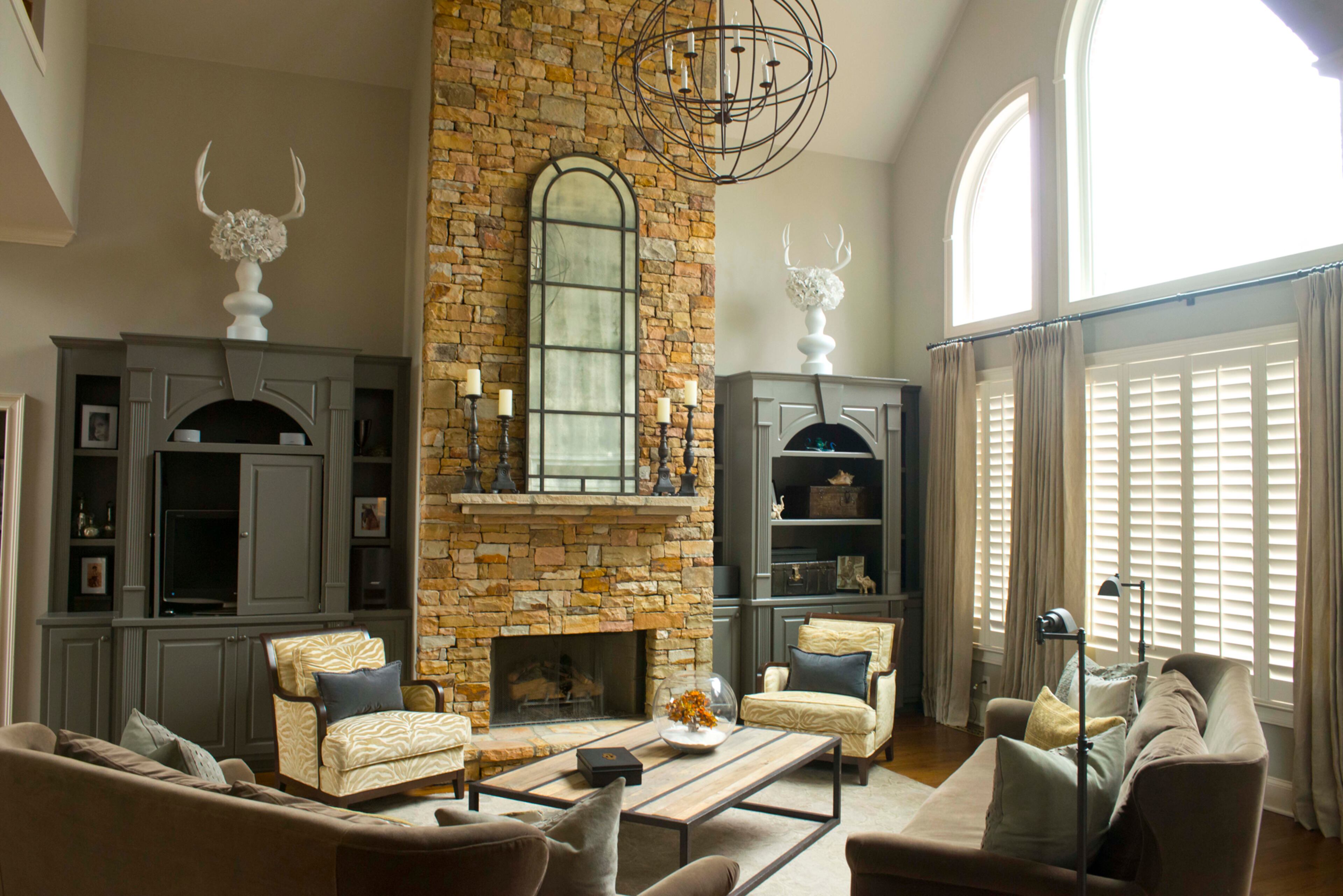 The stacked stone fireplace was already in the home, but the black antique built-in bookcases made the fireplace "get lost" in the room. "We changed the color on the built-ins. It's amazing how a difference in paint can change so many things," Zack says. -- Text by Lori Johnston, for the AJC