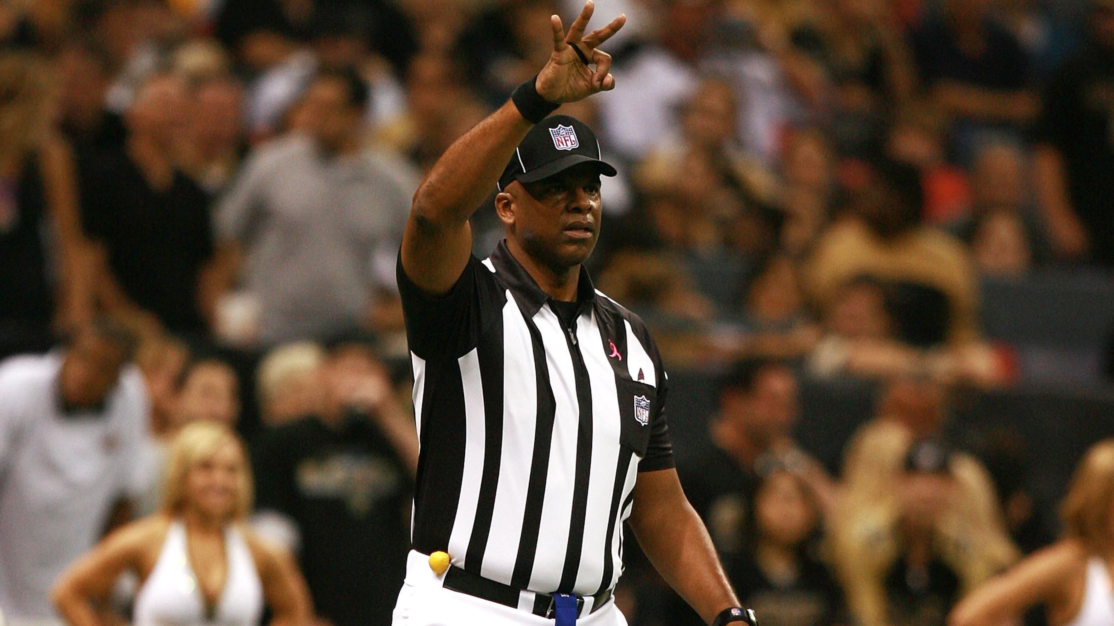 NFL down judge Phil McKinnely (110) played for five seasons with the Atlanta Falcons from 1976–80.