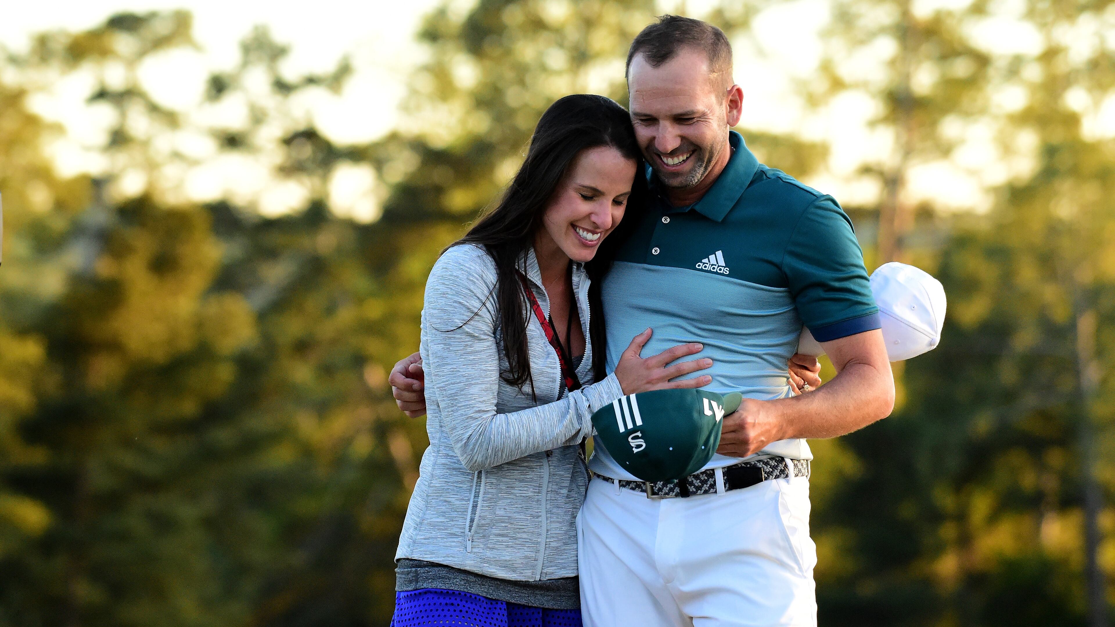 Sergio Garcia and then-fiancee Angela Akins share a moment after his breakthrough 2017 Masters victory. (Harry How/Getty Images)
