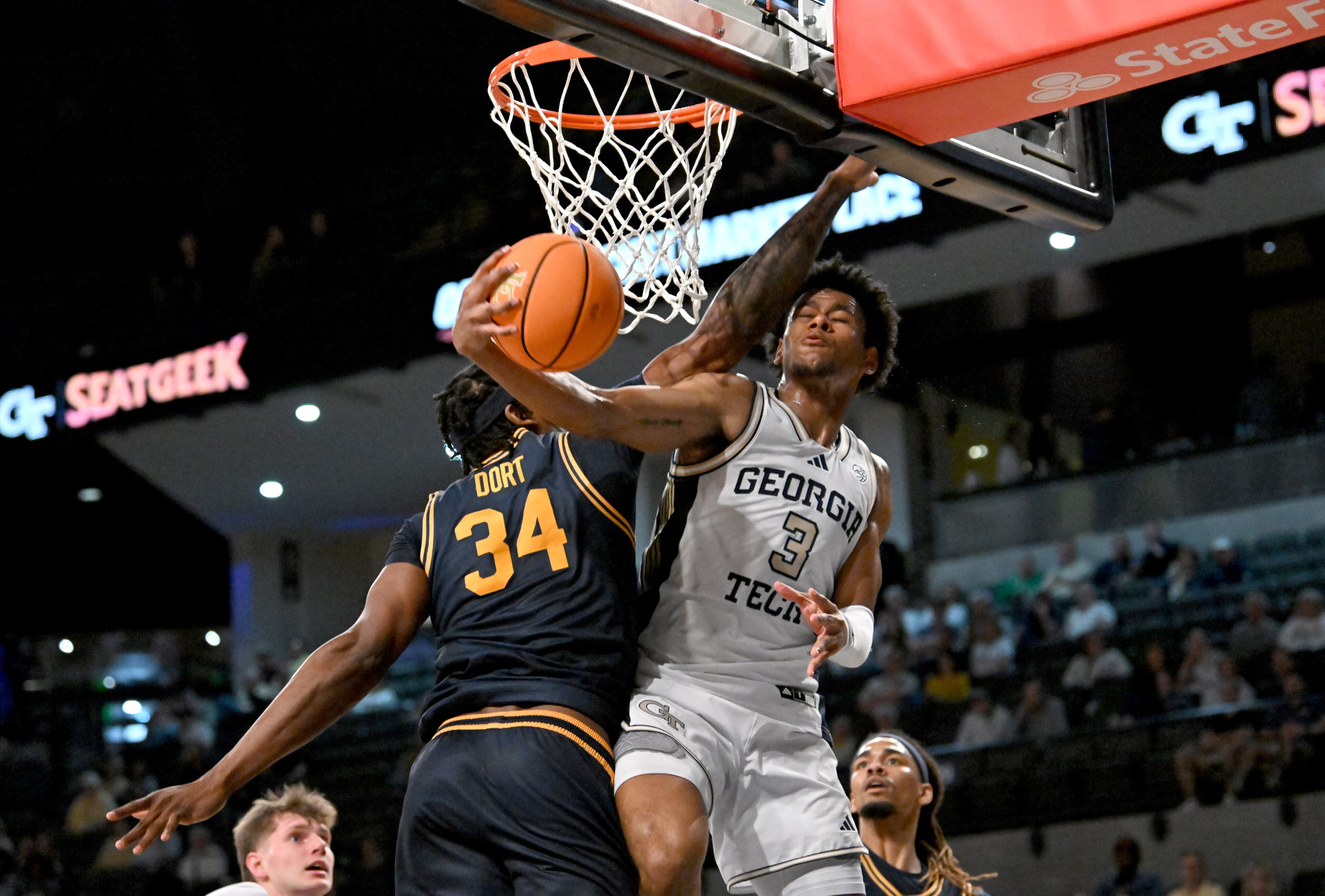 Georgia Tech guard Jaeden Mustaf (3) goes in for a lay-up against California forward Lee Dort (34) during the second half of an NCAA college basketball game at Georgia Tech’s McCamish Pavilion, Wednesday, March 4, 2026, in Atlanta. California won 76-65 over Georgia Tech. (Hyosub Shin/AJC)