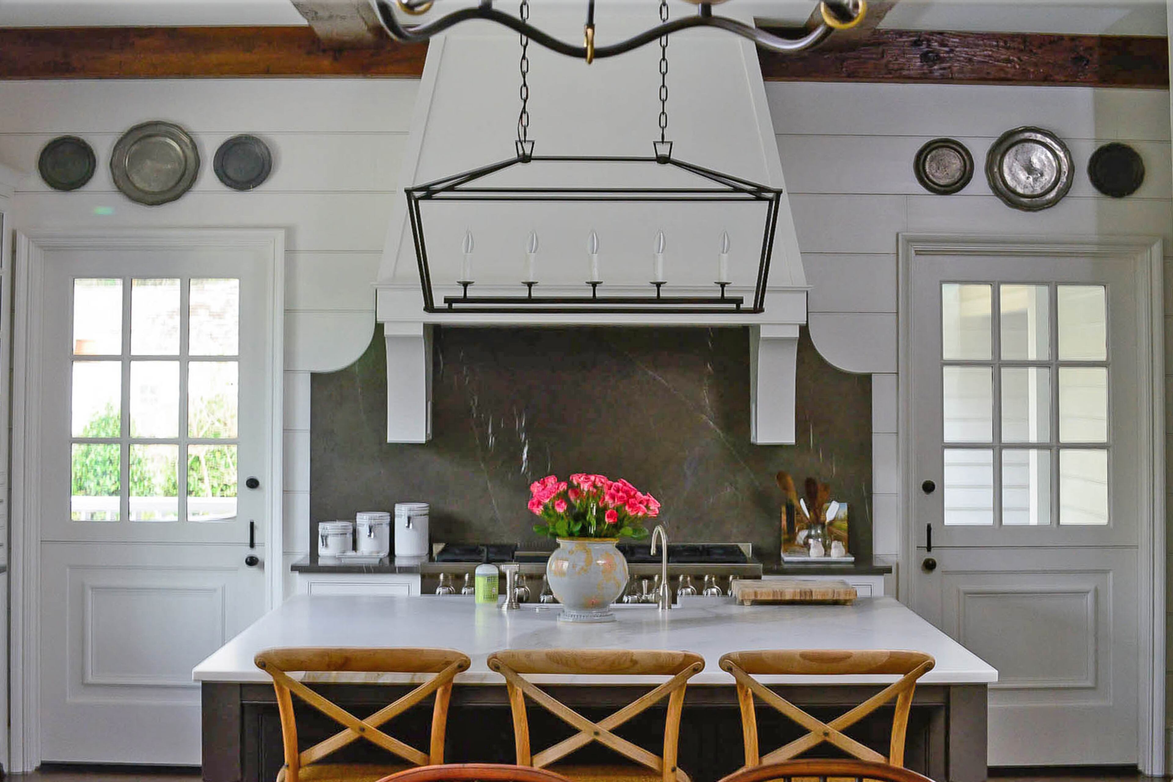 The graphite limestone backsplash has curved edges that add even more interest to the kitchen in the new Buckhead home.