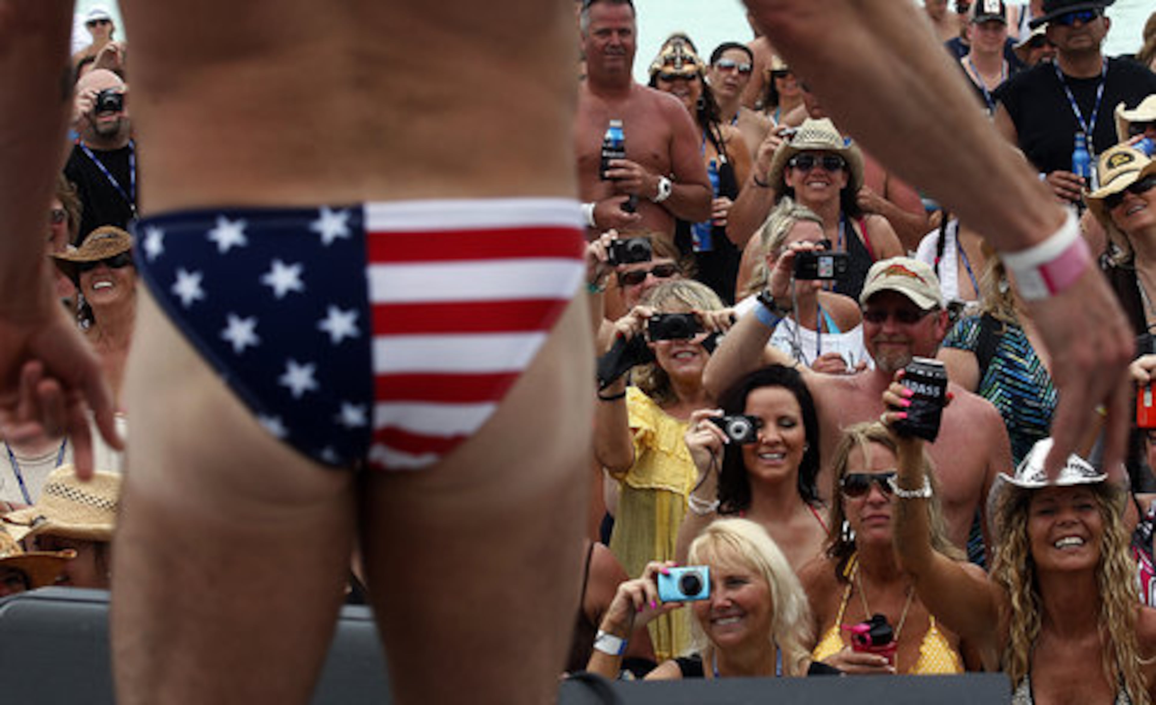 On board the ship, fans enjoy a Speedo contest.