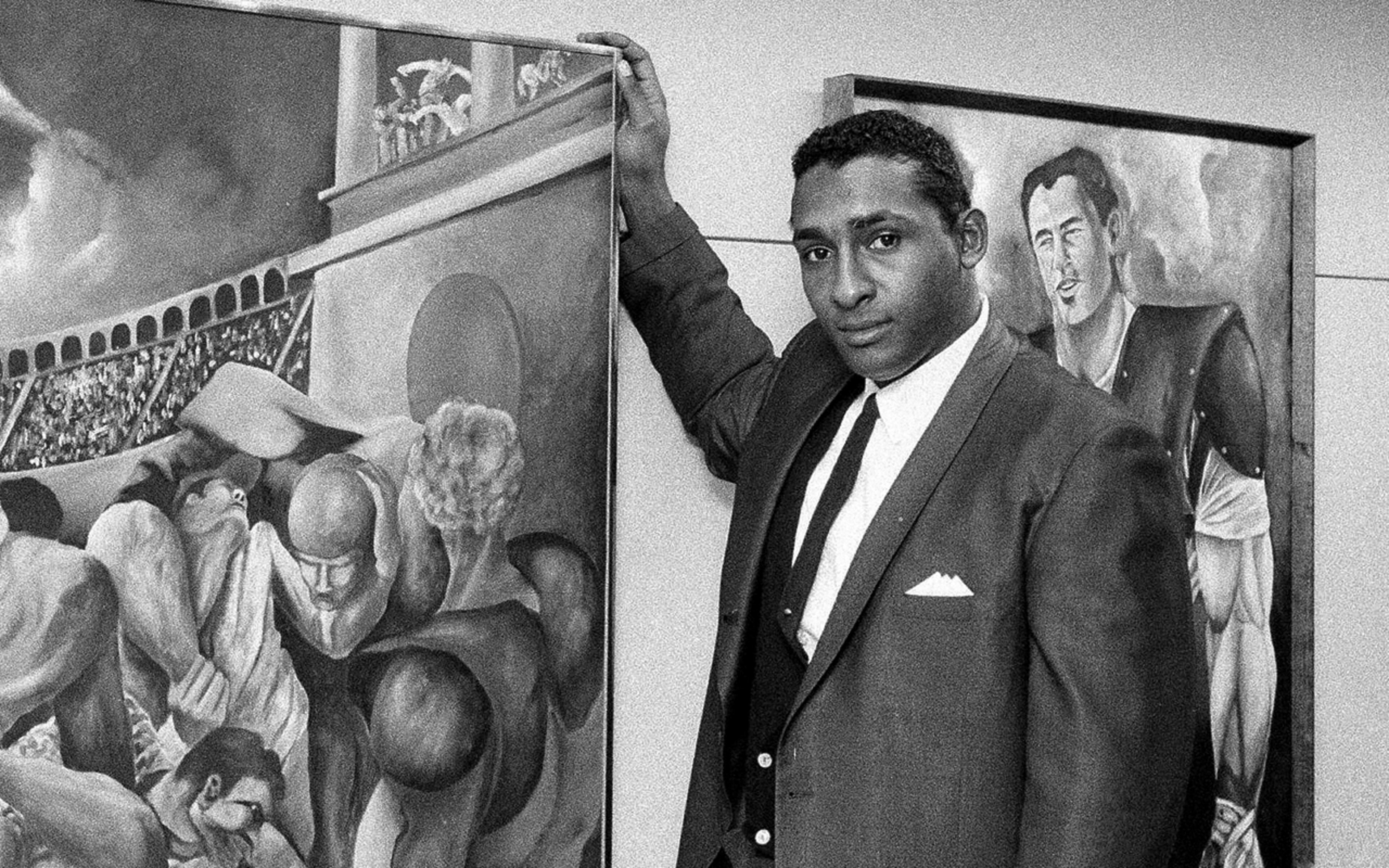 Ernie Barnes: A native of Durham, Barnes didn't have to go far for college. He was a true Renaissance man, as a professional football player, actor and artist. It was as an artist that he touched the world. His artistic style was unique -- distinctive color palettes and black bodies, elongated, but familiar. His work reached its largest audience when Barnes served as the surrogate for the work of J.J. Evans on the television show, 'Good Times.' His classic, 'The Sugar Shack,' a sweaty, hot study of black late night celebration and rhythm, was used on 'Good Times' and on the cover of Marvin Gaye's 'I Want You.' (AP Photo/John Rooney)