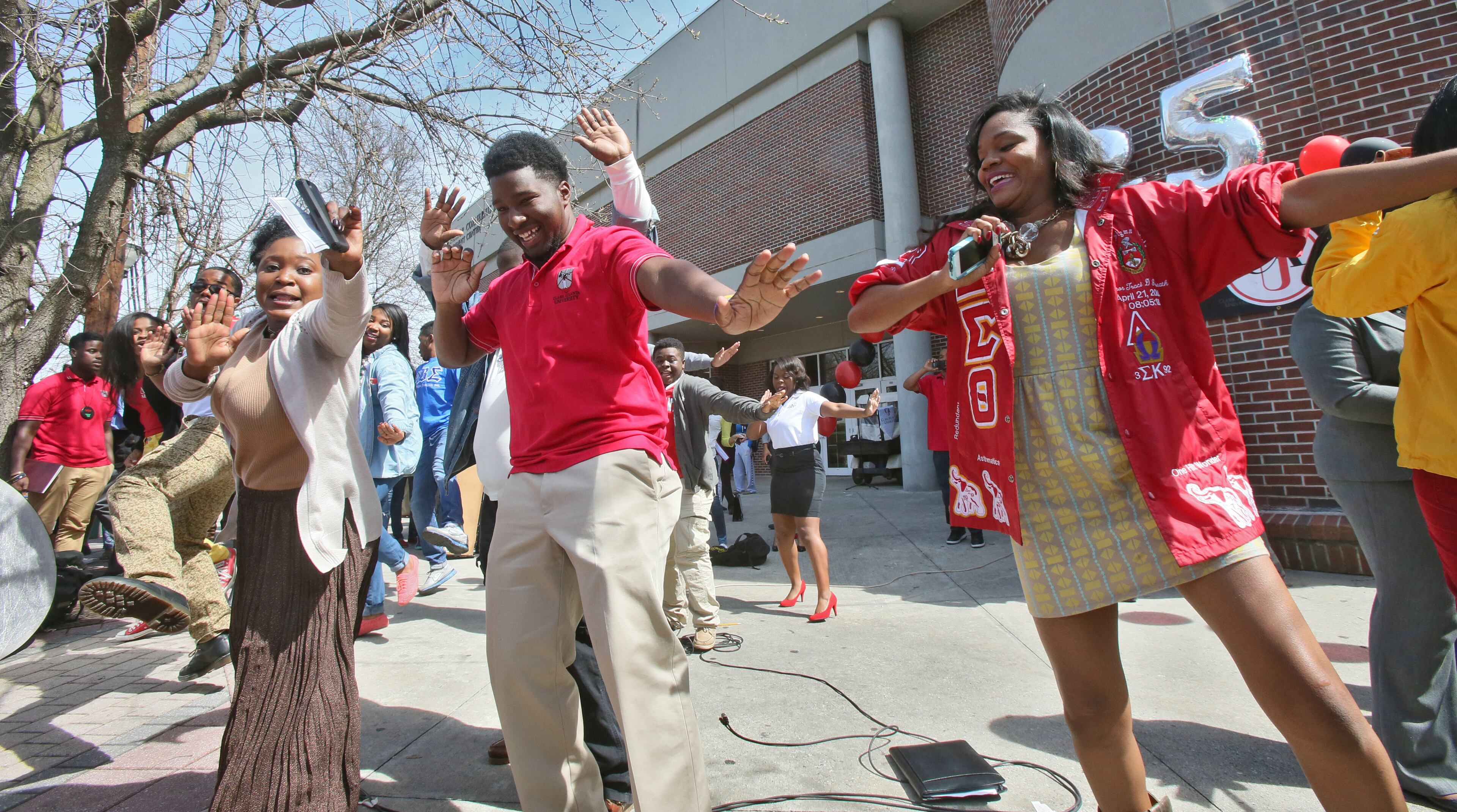 March 21, 2014 - Atlanta - Clark Atlanta University campus guides put on an impromptu dance and cheer at the closing of the rally. Clark Atlanta University celebrated its 25th anniversary with a rally on the Henderson Promenade, one of several Founders Week events, which will conclude with a songfest and gala this weekend. The rally included a performance by the Mighty Marching Panthers Drum line, the CAU cheerleaders, speakers, and a 25th anniversary cake. The event celebrates the 25th anniversary of the consolidation of its parent institutions, Atlanta University (founded in 1865) and Clark College (founded in 1869). BOB ANDRES / BANDRES@AJC.COM
