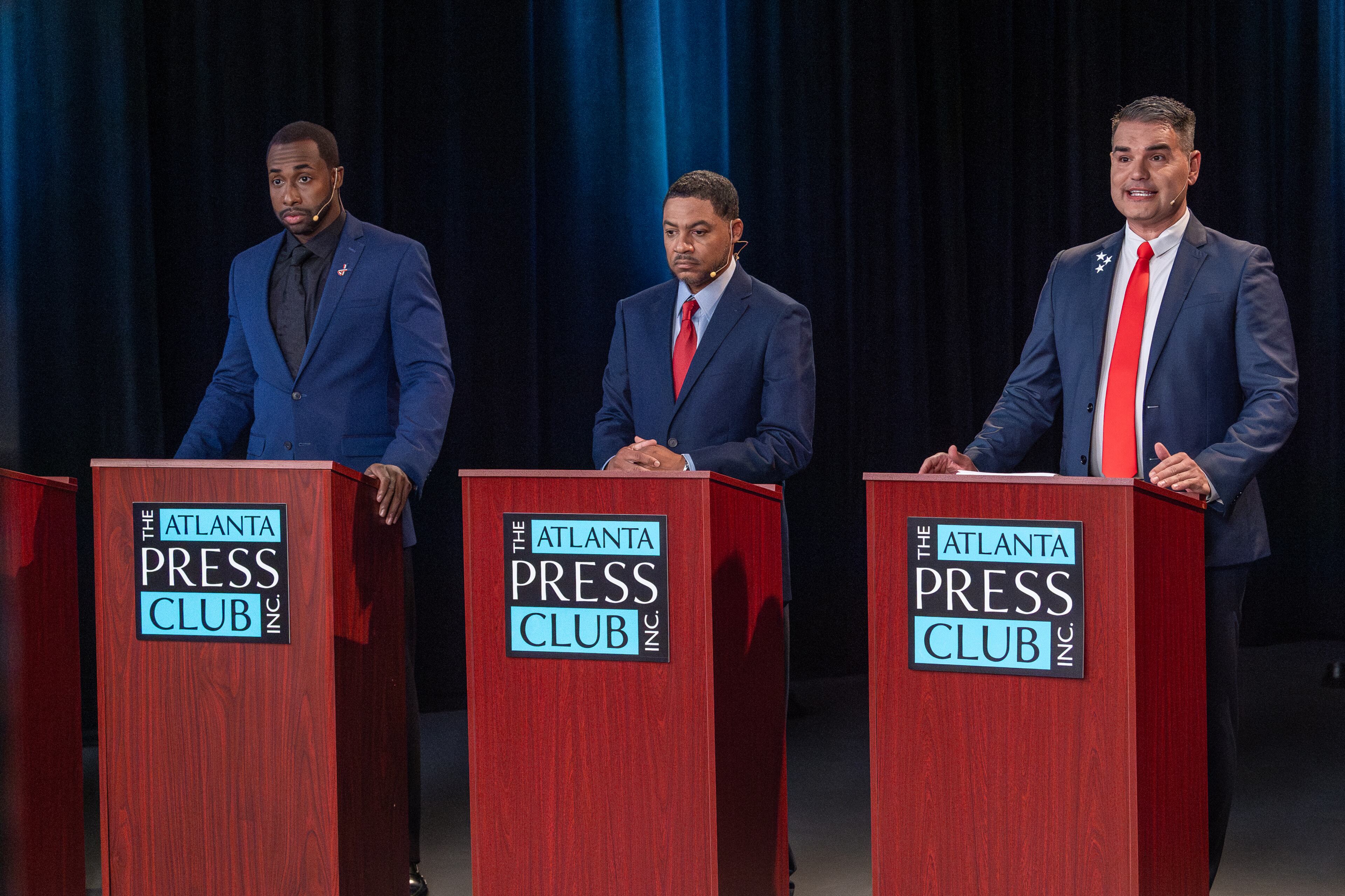 Candidates for mayor Eddie Andrew Meredith (left), Kalema Jackson (center) and Helmut Love Domagalski (right) take part in the Atlanta Press Club debate on Oct. 8, 2025.