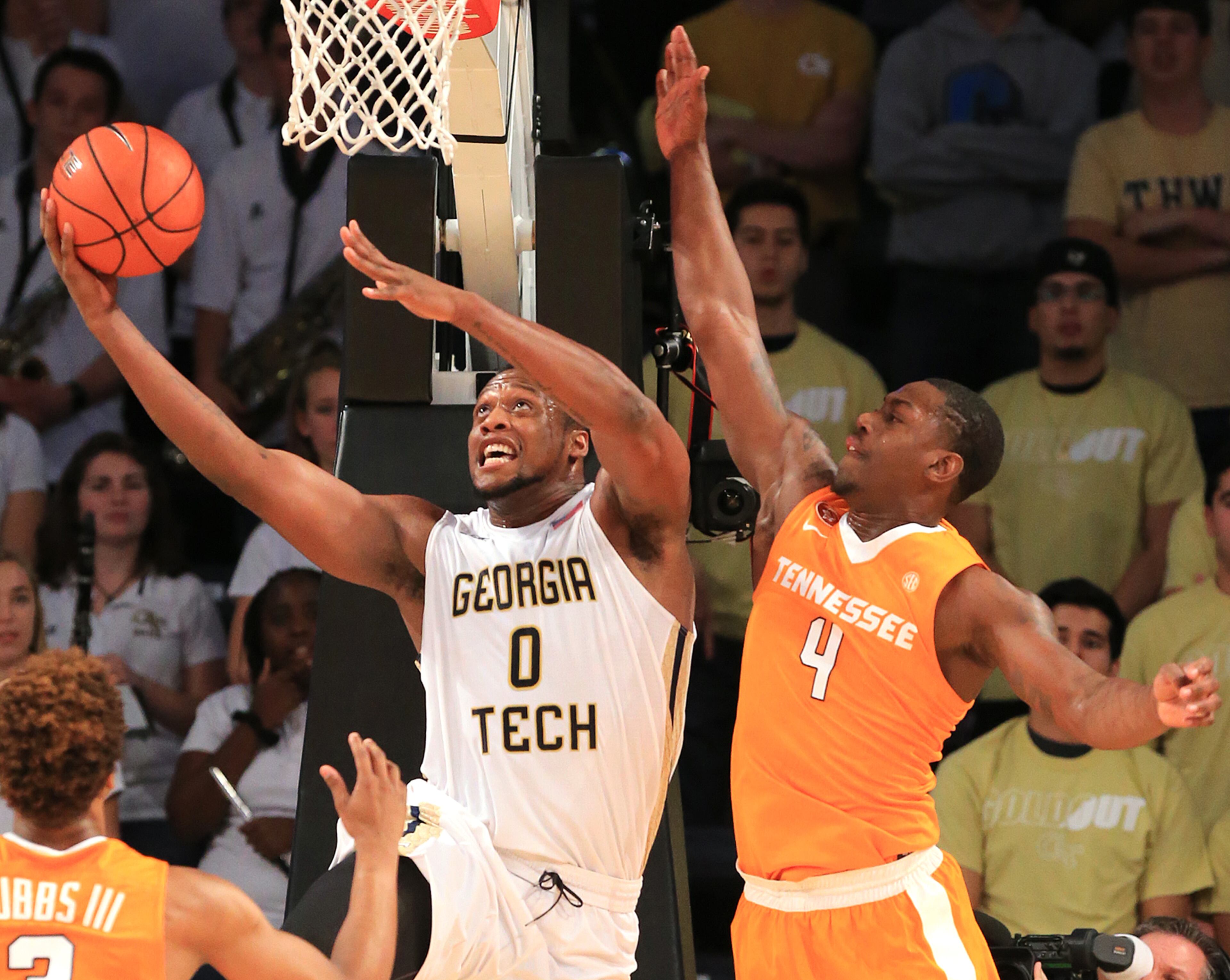 Georgia Tech forward Charles Mitchell goes to the basket for a layup past Tennessee defender Armani Moore during the first half in a basketball game on Monday, Nov. 16, 2015 in Atlanta. Curtis Compton / ccompton@ajc.com